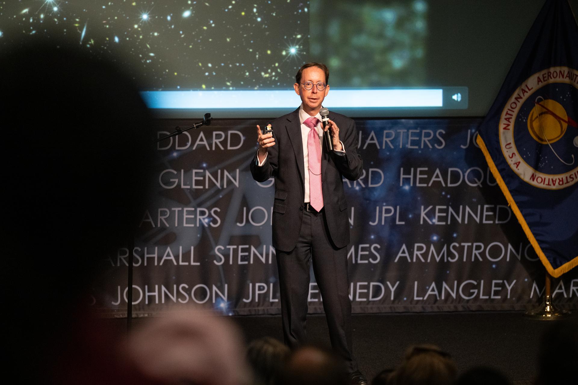 Dr. Dominic Benford, program scientist for the nancy grace roman space telescope, speaks at a Frontiers Forum event titled "Countdown to Launch – Why We’re Excited about the Nancy Grace Roman Space Telescope," Thursday, Aug. 6, 2026, at the Mary W. Jackson NASA Headquarters building in Washington. Photo Credit: (NASA/Keegan Barber)