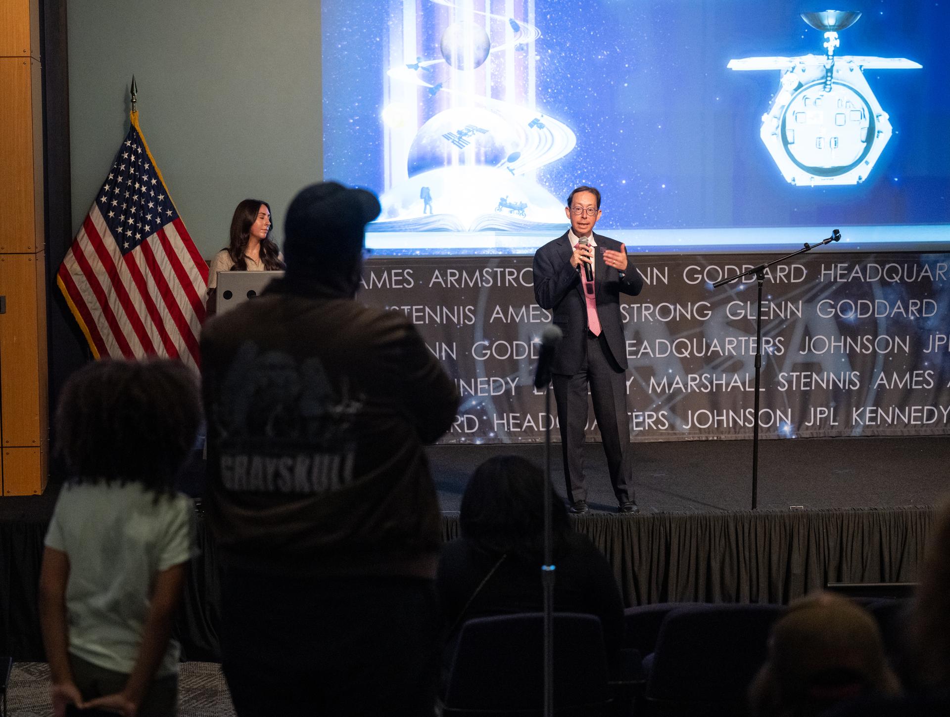 Dr. Dominic Benford, program scientist for the nancy grace roman space telescope, answers questions from visitors during a Frontiers Forum event titled "Countdown to Launch – Why We’re Excited about the Nancy Grace Roman Space Telescope," Thursday, Aug. 6, 2026, at the Mary W. Jackson NASA Headquarters building in Washington.  Photo Credit: (NASA/Keegan Barber)