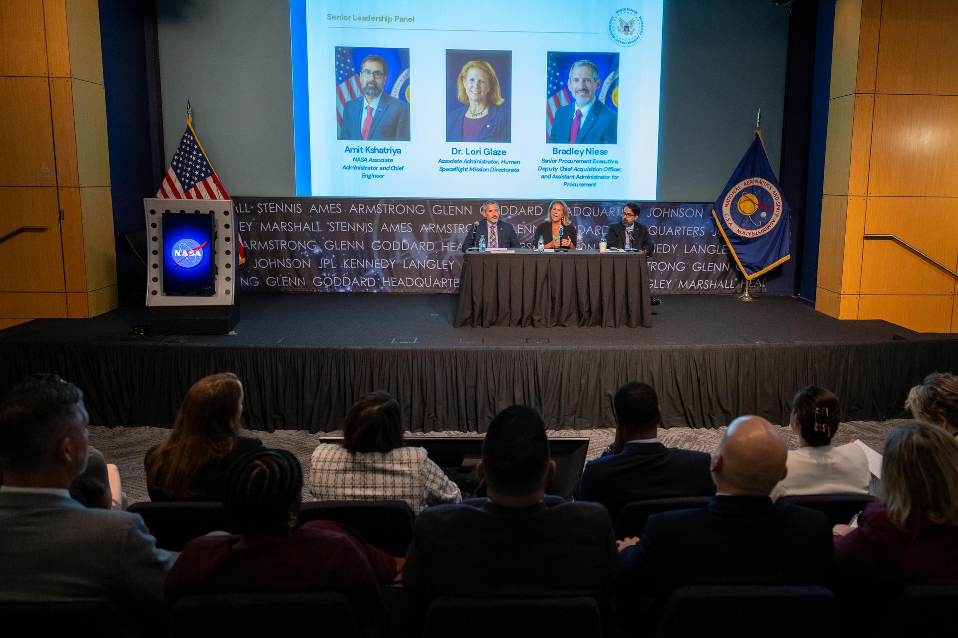 Lori Glaze, associate administrator for NASA’s Human Spaceflight Mission Directorate, center, delivers remarks alongside NASA Associate Administrator Amit Kshatriya, and Bradley Niese, assistant administrator for procurement, during a White House Leadership Development Program event Friday, Aug. 21, 2026, at the Mary W. Jackson NASA Headquarters building in Washington.  Photo Credit: (NASA/Keegan Barber)