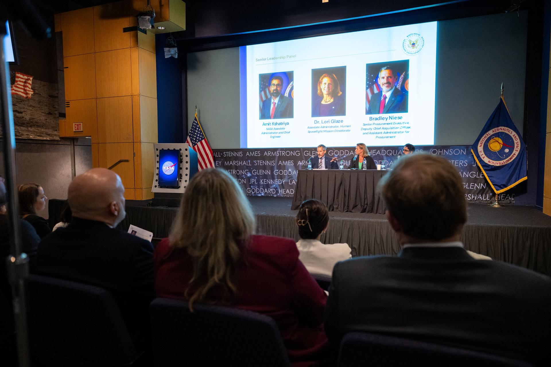 Bradley Niese, assistant administrator for procurement, left, delivers remarks alongside NASA Associate Administrator Amit Kshatriya, and Lori Glaze, associate administrator for NASA’s Human Spaceflight Mission Directorate, during a White House Leadership Development Program event Friday, Aug. 21, 2026, at the Mary W. Jackson NASA Headquarters building in Washington.  Photo Credit: (NASA/Keegan Barber)