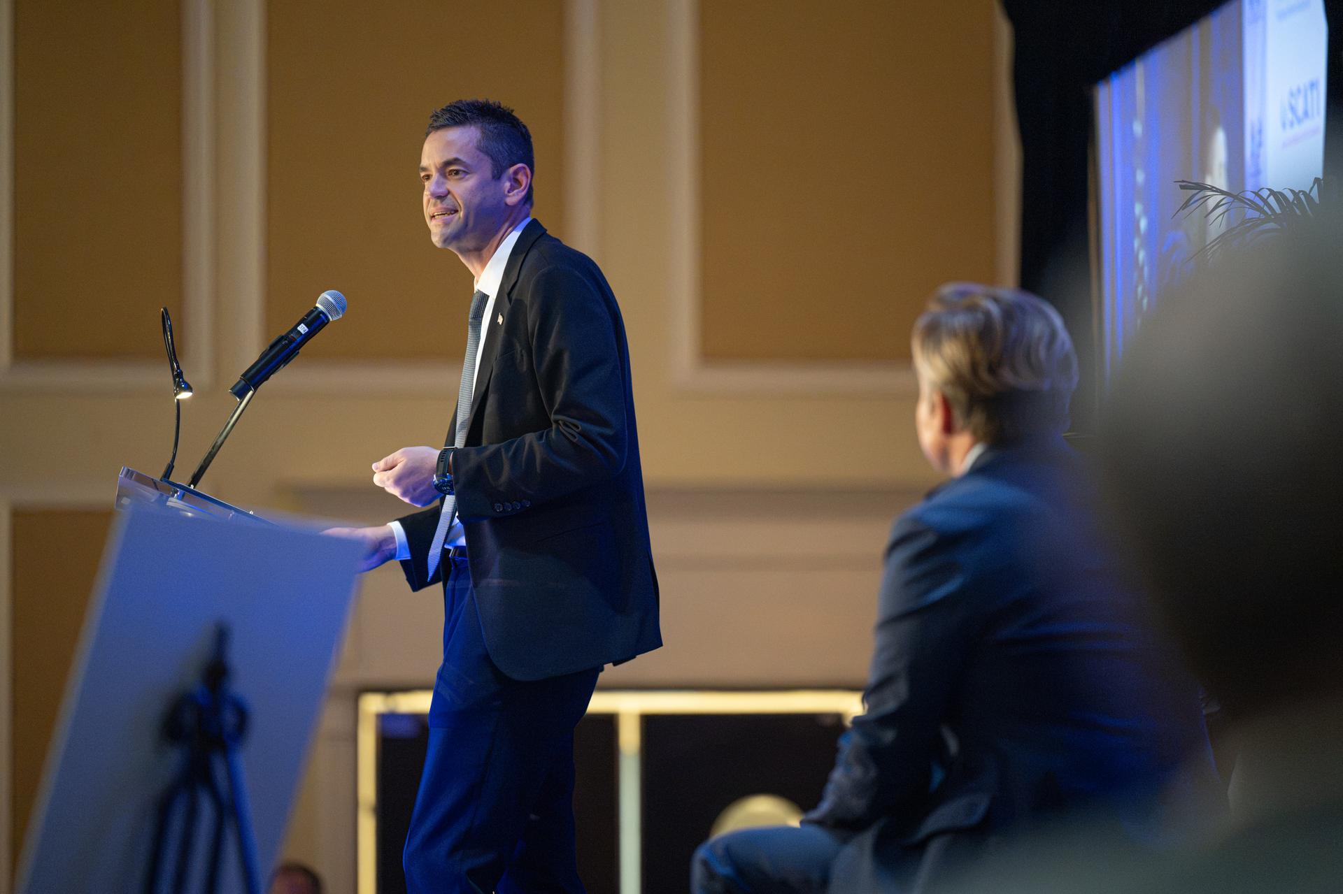 NASA Administrator Jared Isaacman, left, participates in a fireside chat with U.S. Rep. Mike Haridopolos of Florida’s 8th congressional district, right, Friday, Aug. 21, 2026, at the 8th Annual Space Coast Symposium & Expo in Cape Canaveral, Fla. Photo Credit: (NASA/John Kraus)