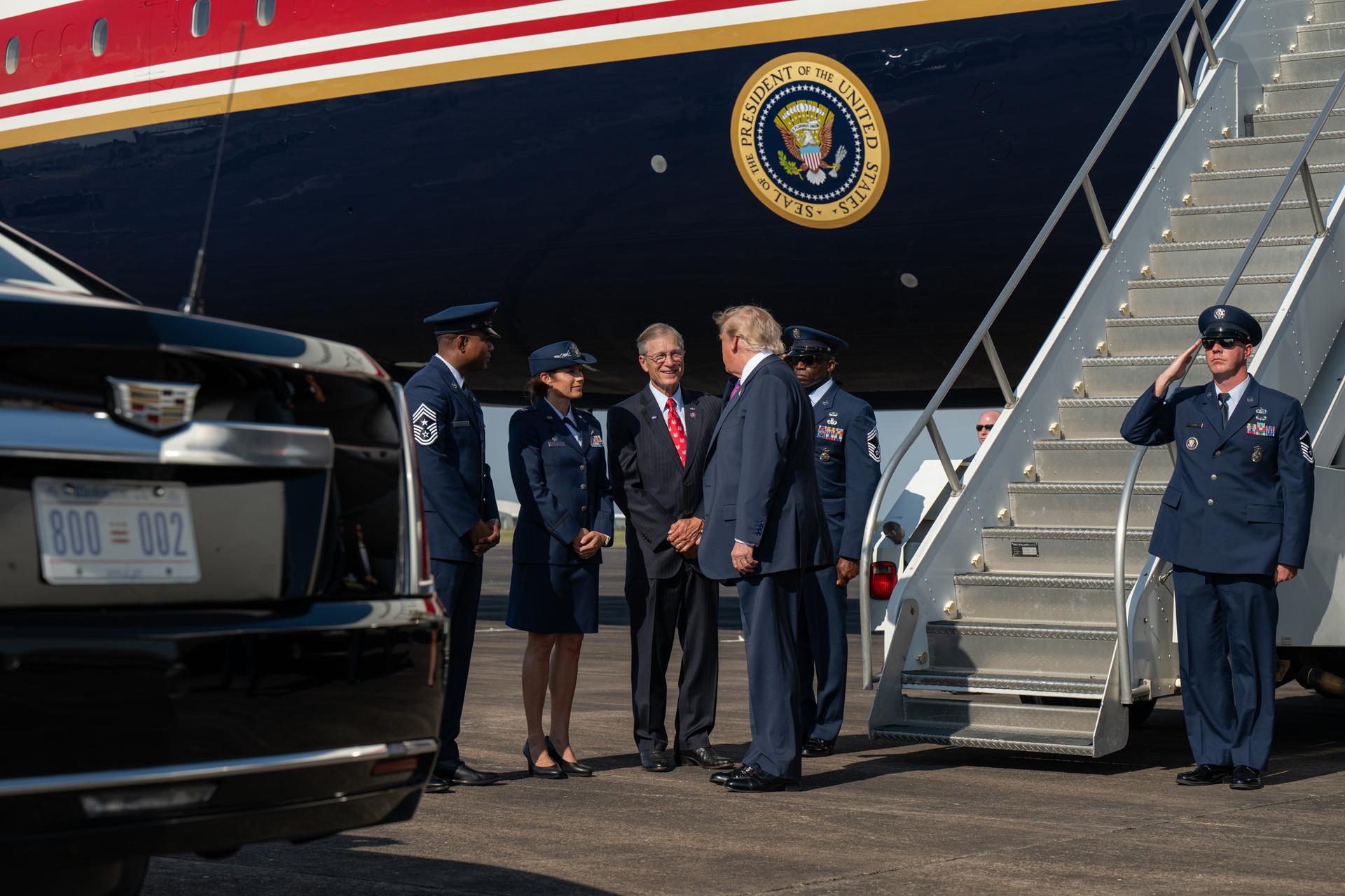 President Donald Trump speaks with members of the U.S. Air Force and U.S. Representative Brian Babin of Texas's 36th congressional district after disembarking Air Force One, Thursday, Aug. 27, 2026, at Ellington Field Joint Reserve Base in Houston, Texas. President Trump is visiting NASA’s Johnson Space Center to award the Congressional Space Medal of Honor to the Artemis II crew on Friday, Aug. 28. Photo Credit: (NASA/John Kraus)