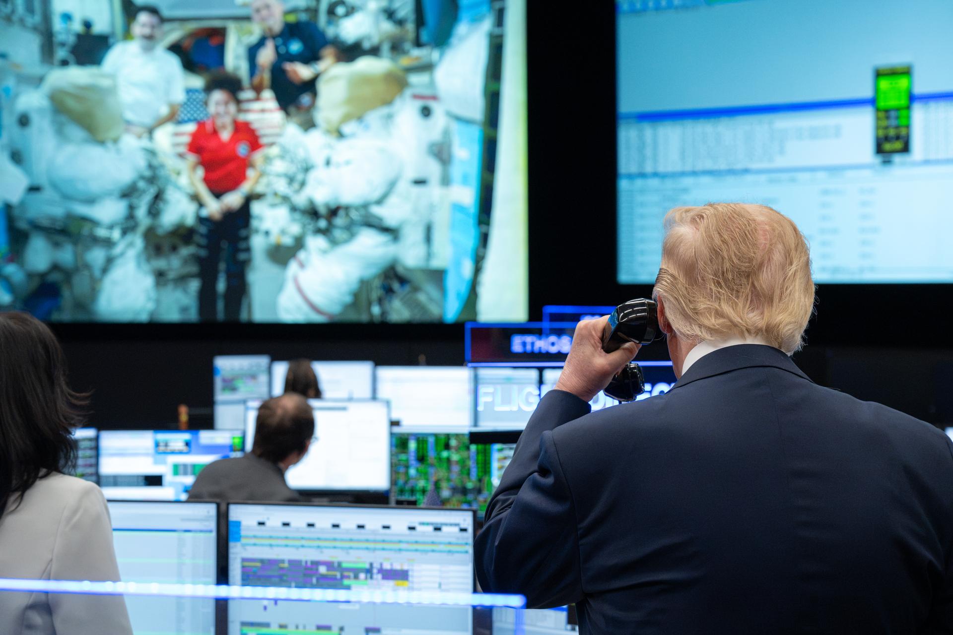President Donald Trump speaks with Expedition 75 crewmembers Jack Hathaway, Anil Menon, and Jessica Meir on board the International Space Station during a visit to the Christopher C. Kraft Jr. Mission Control Center, Friday, Aug. 28, 2026, at NASA’s Johnson Space Center in Houston, Texas. Photo Credit: (NASA/John Kraus)
