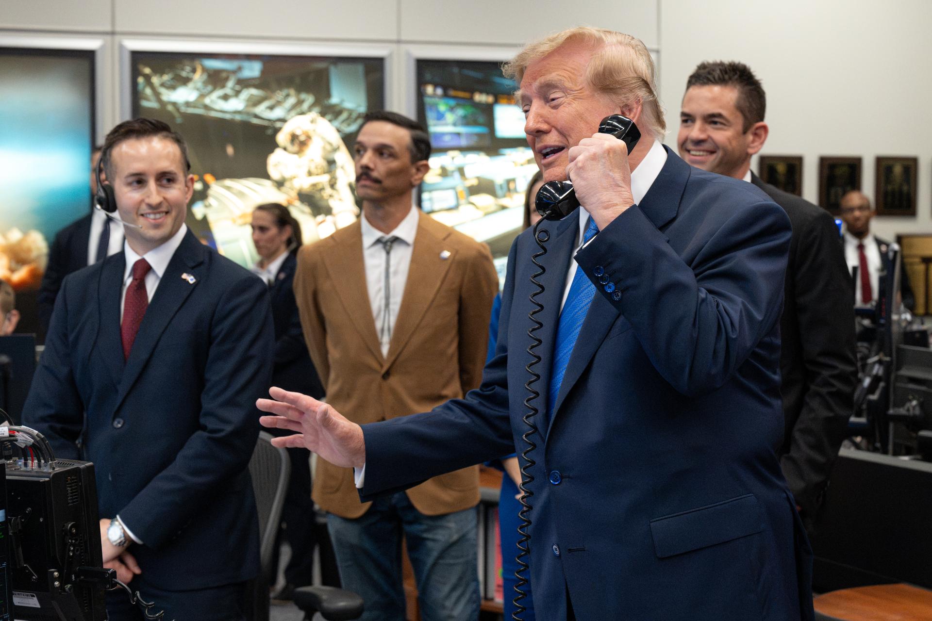 President Donald Trump speaks with Expedition 75 crewmembers Jack Hathaway, Anil Menon, and Jessica Meir on board the International Space Station during a visit to the Christopher C. Kraft Jr. Mission Control Center, Friday, Aug. 28, 2026, at NASA’s Johnson Space Center in Houston, Texas. Photo Credit: (NASA/John Kraus)