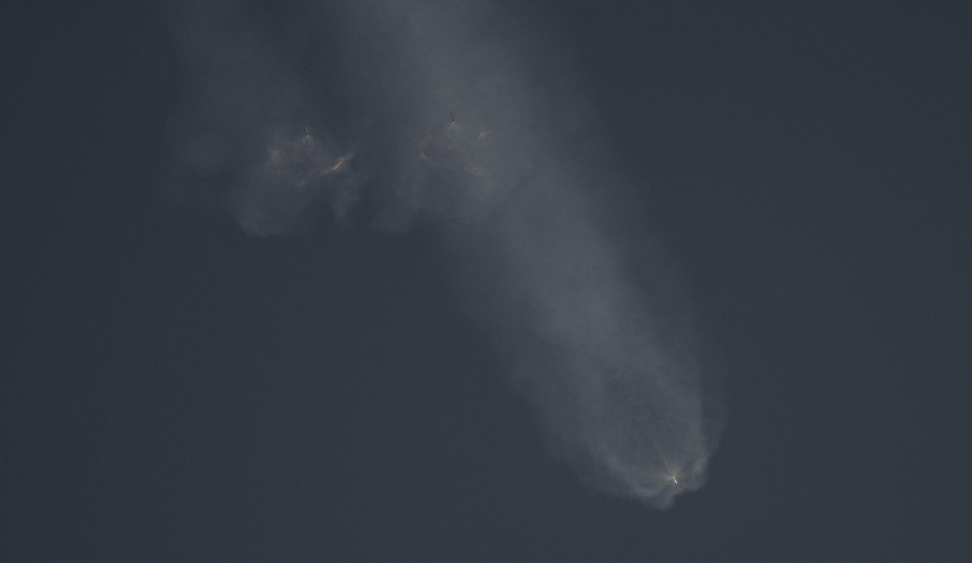 A pair of SpaceX Falcon Heavy side boosters perform their boost back burns following separation from the center core during the launch of NASA’S Nancy Grace Roman Space Telescope from Launch Complex 39A, Sunday, Aug. 30, 2026, at NASA’s Kennedy Space Center in Florida. Roman will investigate dark energy and dark matter, conduct a statistical census of planetary systems, and enable a broad range of additional astrophysics research. Launch occurred at 7:26 a.m. EDT. Photo Credit (NASA/Joel Kowsky)