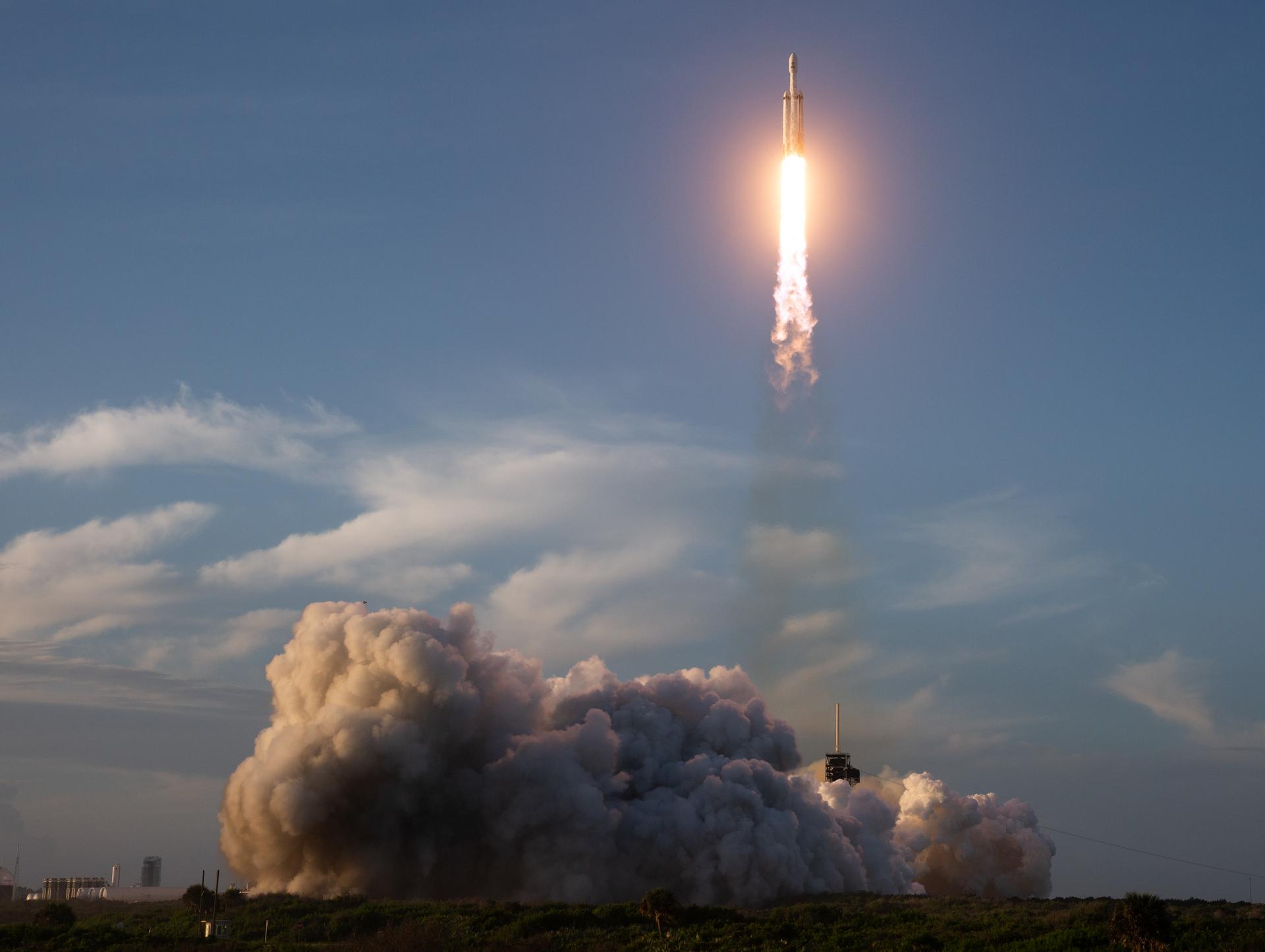 A SpaceX Falcon Heavy rocket launches with NASA’S Nancy Grace Roman Space Telescope onboard from Launch Complex 39A, Sunday, Aug. 30, 2026, at NASA’s Kennedy Space Center in Florida. Roman will investigate dark energy and dark matter, conduct a statistical census of planetary systems, and enable a broad range of additional astrophysics research. Launch occurred at 7:26 a.m. EDT. Photo Credit (NASA/Joel Kowsky)