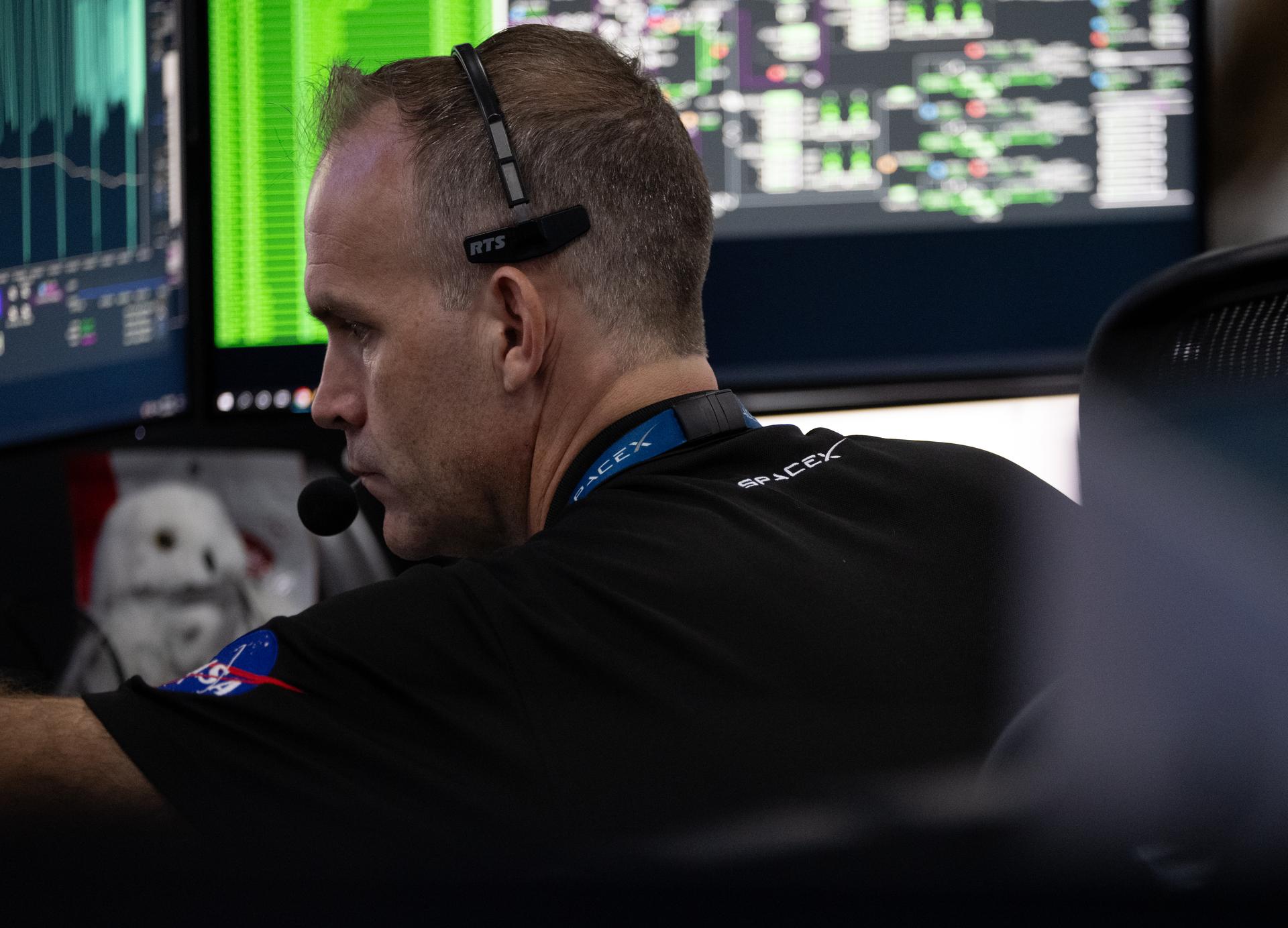 Joseph Dant, chief safety and mission assurance officer for NASA’s Launch Services Program, is seen as he monitors the countdown inside SpaceX’s Hangar X for the launch of a SpaceX Falcon Heavy rocket with NASA’S Nancy Grace Roman Space Telescope from Launch Complex 39A at NASA’s Kennedy Space Center, Sunday, Aug. 30, 2026, in Florida. Roman will investigate dark energy and dark matter, conduct a statistical census of planetary systems, and enable a broad range of additional astrophysics research. Launch occurred at 7:26 a.m. EDT. Photo Credit (NASA/Joel Kowsky)