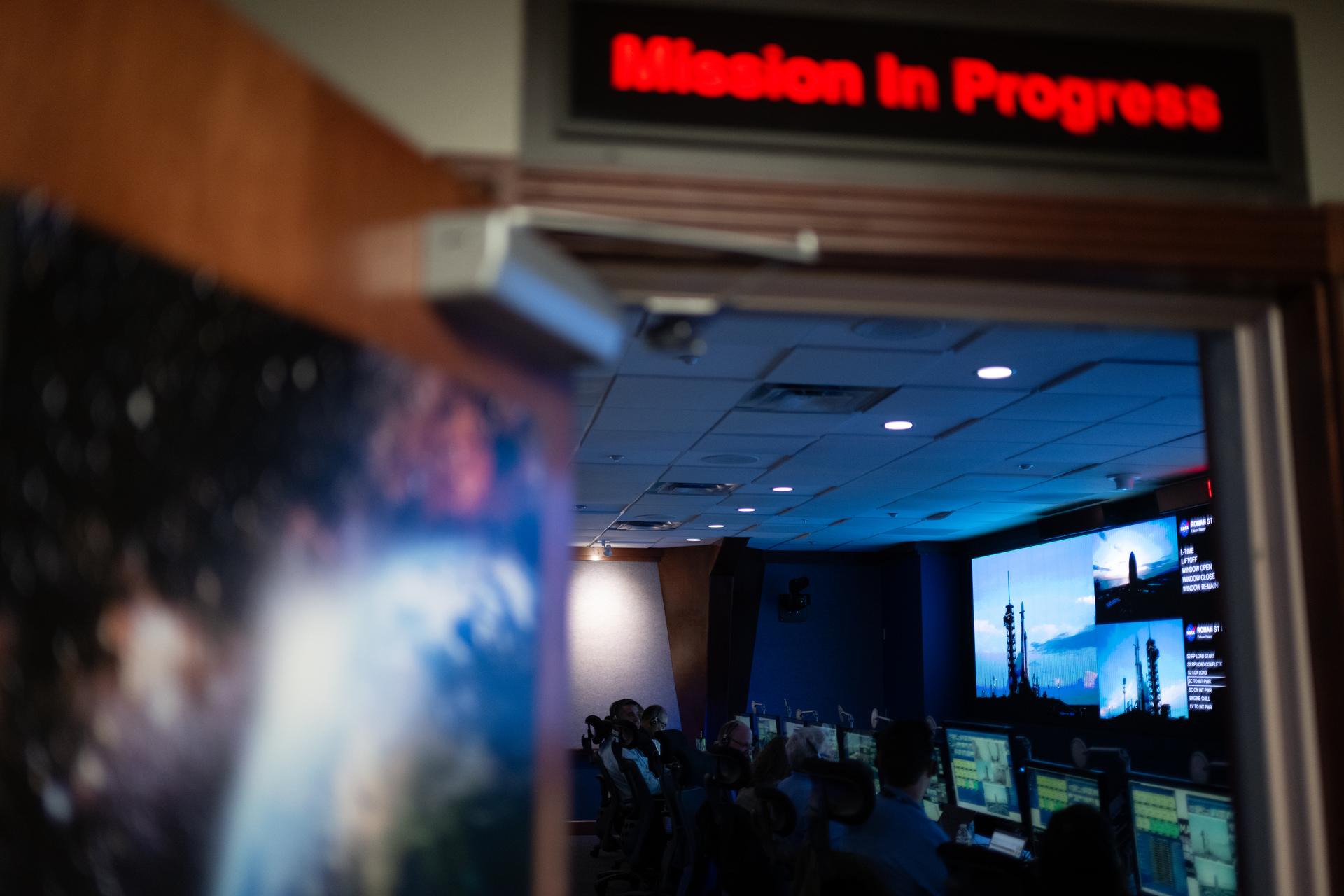 The Mission Directors Center inside Hangar AE at Cape Canaveral Space Force Station is seen as teams monitor the countdown for the launch of a SpaceX Falcon Heavy rocket with NASA’S Nancy Grace Roman Space Telescope from Launch Complex 39A at NASA’s Kennedy Space Center, Sunday, Aug. 30, 2026, in Florida. Roman will investigate dark energy and dark matter, conduct a statistical census of planetary systems, and enable a broad range of additional astrophysics research. Launch occurred at 7:26 a.m. EDT. Photo Credit (NASA/Joel Kowsky)