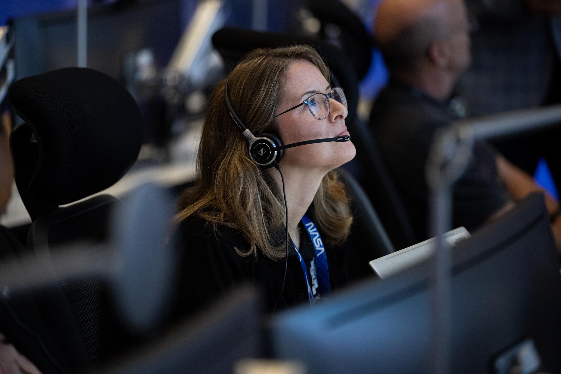 Jennifer Nufer, COSI mission manager for NASA’s Launch Services Program, monitors the countdown inside Hangar AE at Cape Canaveral Space Force Station for the launch of a SpaceX Falcon Heavy rocket with NASA’S Nancy Grace Roman Space Telescope from Launch Complex 39A at NASA’s Kennedy Space Center, Sunday, Aug. 30, 2026, in Florida. Roman will investigate dark energy and dark matter, conduct a statistical census of planetary systems, and enable a broad range of additional astrophysics research. Launch occurred at 7:26 a.m. EDT. Photo Credit (NASA/Joel Kowsky)