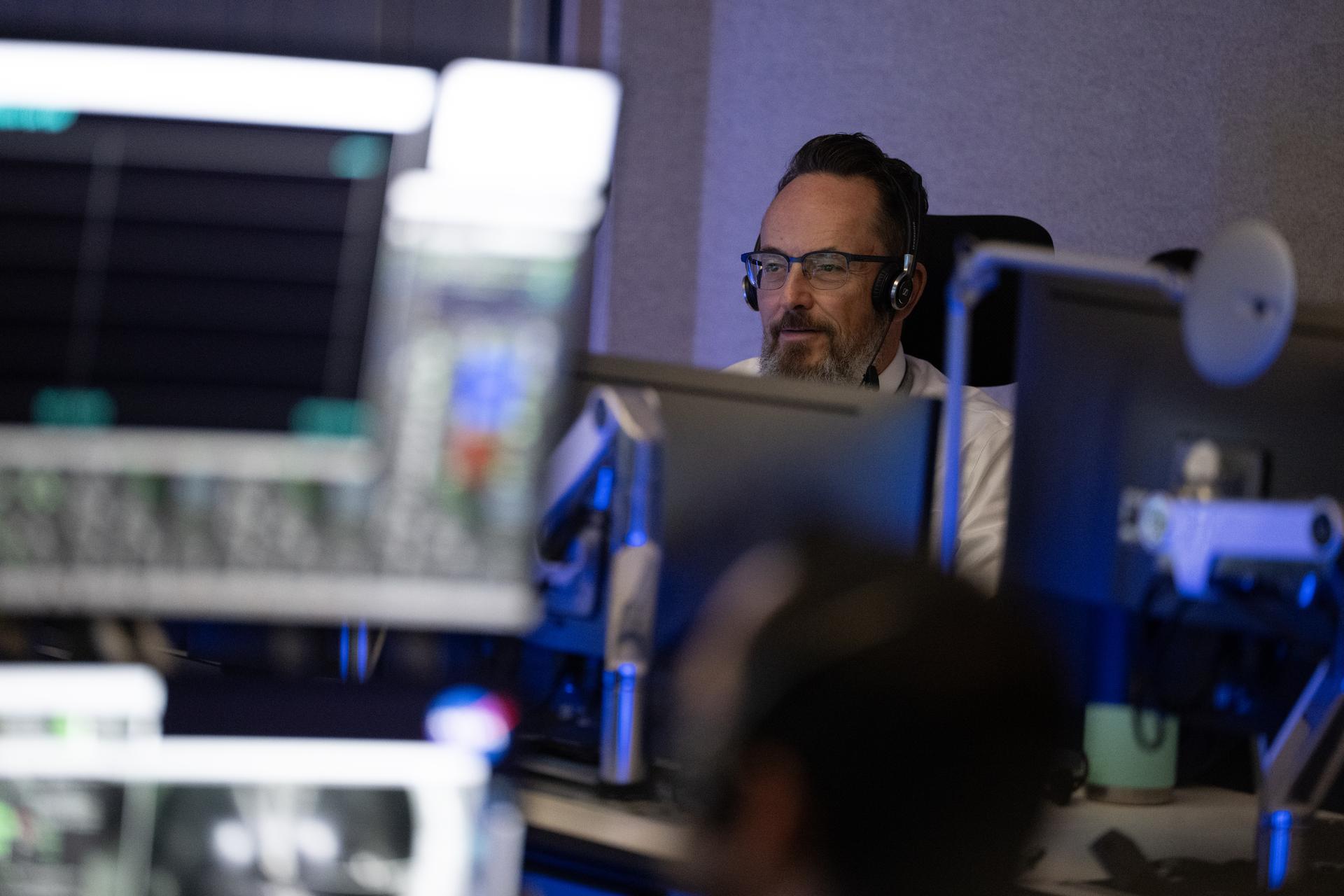 Brian Beaver, deputy division chief for the flight analysis division in NASA’s Launch Services Program, monitors the countdown inside Hangar AE at Cape Canaveral Space Force Station for the launch of a SpaceX Falcon Heavy rocket with NASA’S Nancy Grace Roman Space Telescope from Launch Complex 39A at NASA’s Kennedy Space Center, Sunday, Aug. 30, 2026, in Florida. Roman will investigate dark energy and dark matter, conduct a statistical census of planetary systems, and enable a broad range of additional astrophysics research. Launch occurred at 7:26 a.m. EDT. Photo Credit (NASA/Joel Kowsky)