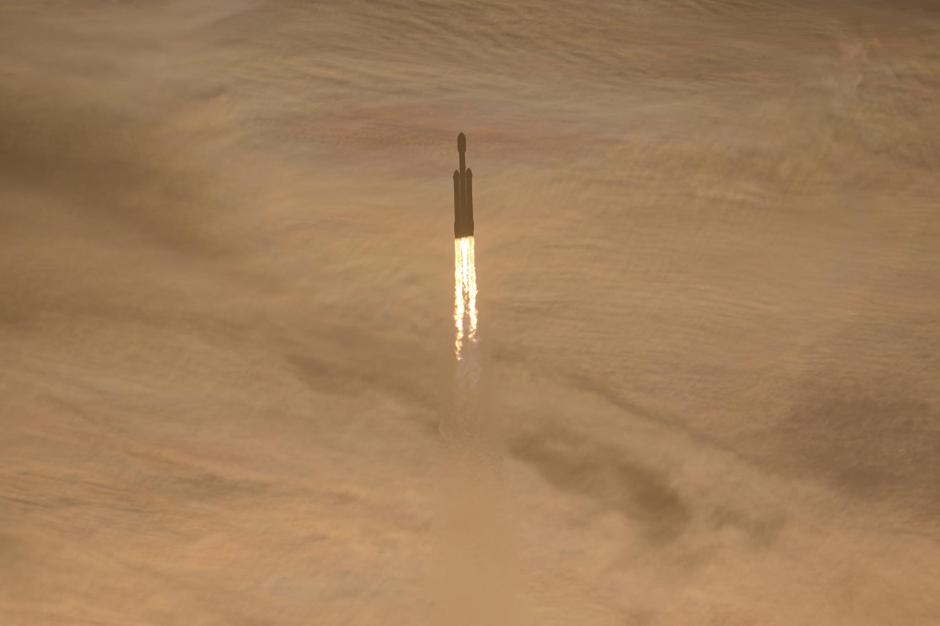 A SpaceX Falcon Heavy carrying NASA's Nancy Grace Roman Space Telescope climbs through golden clouds after launch
