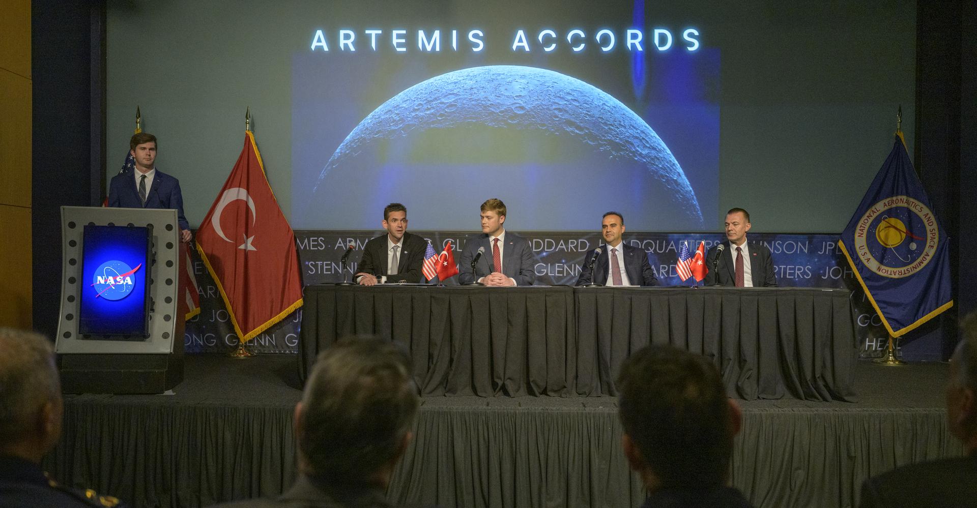 NASA Deputy Press Secretary George Alderman, left, NASA Administrator Jared Isaacman, U.S. Deputy Assistant Secretary of State for Space and Environment Connor Tomlinson, Turkish Minister of Industry and Technology, Mehmet Fatih Kacır, and Turkish Space Agency President, Yusuf Kıraç, right, are seen during an Artemis Accords signing ceremony Monday, August 31, 2026, at the Mary W. Jackson NASA Headquarters building in Washington. Türkiye is the 71st country to sign the Artemis Accords, which establish a practical set of principles to guide space exploration cooperation among nations participating in NASA’s Artemis program. Photo Credit: (NASA/Bill Ingalls)