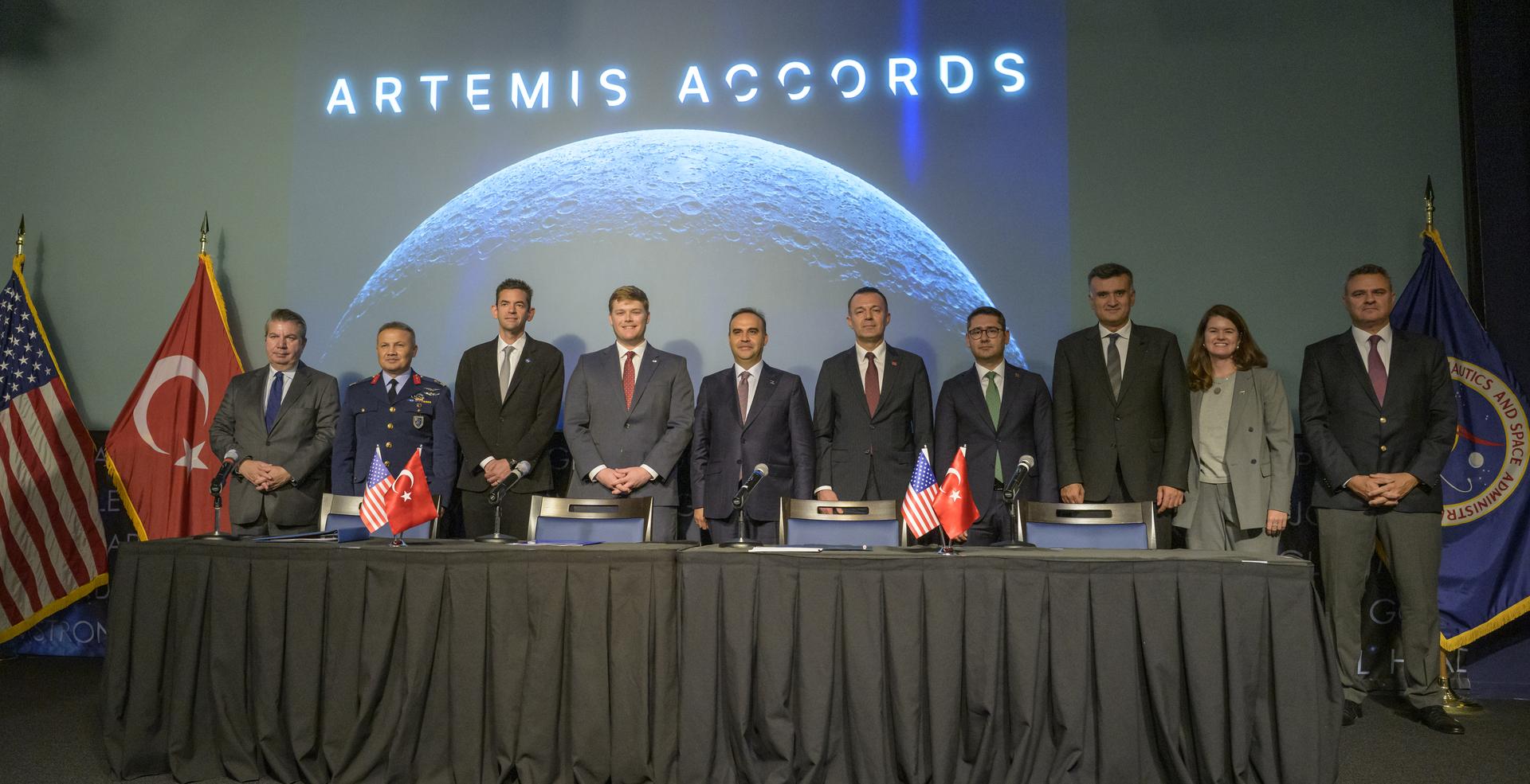 NASA Administrator Jared Isaacman, 3rd from left, U.S. Deputy Assistant Secretary of State for Space and Environment Connor Tomlinson, 4th from left, Turkish Minister of Industry and Technology, Mehmet Fatih Kacır, 5th from left, Turkish Space Agency President, Yusuf Kıraç, 6th from left, and other dignitaries, pose for a group photograph after the signing of the Artemis Accords with the Republic of Türkiye, Monday, August 31, 2026, at the Mary W. Jackson NASA Headquarters building in Washington. Türkiye is the 71st country to sign the Artemis Accords, which establish a practical set of principles to guide space exploration cooperation among nations participating in NASA’s Artemis program. Photo Credit: (NASA/Bill Ingalls)
