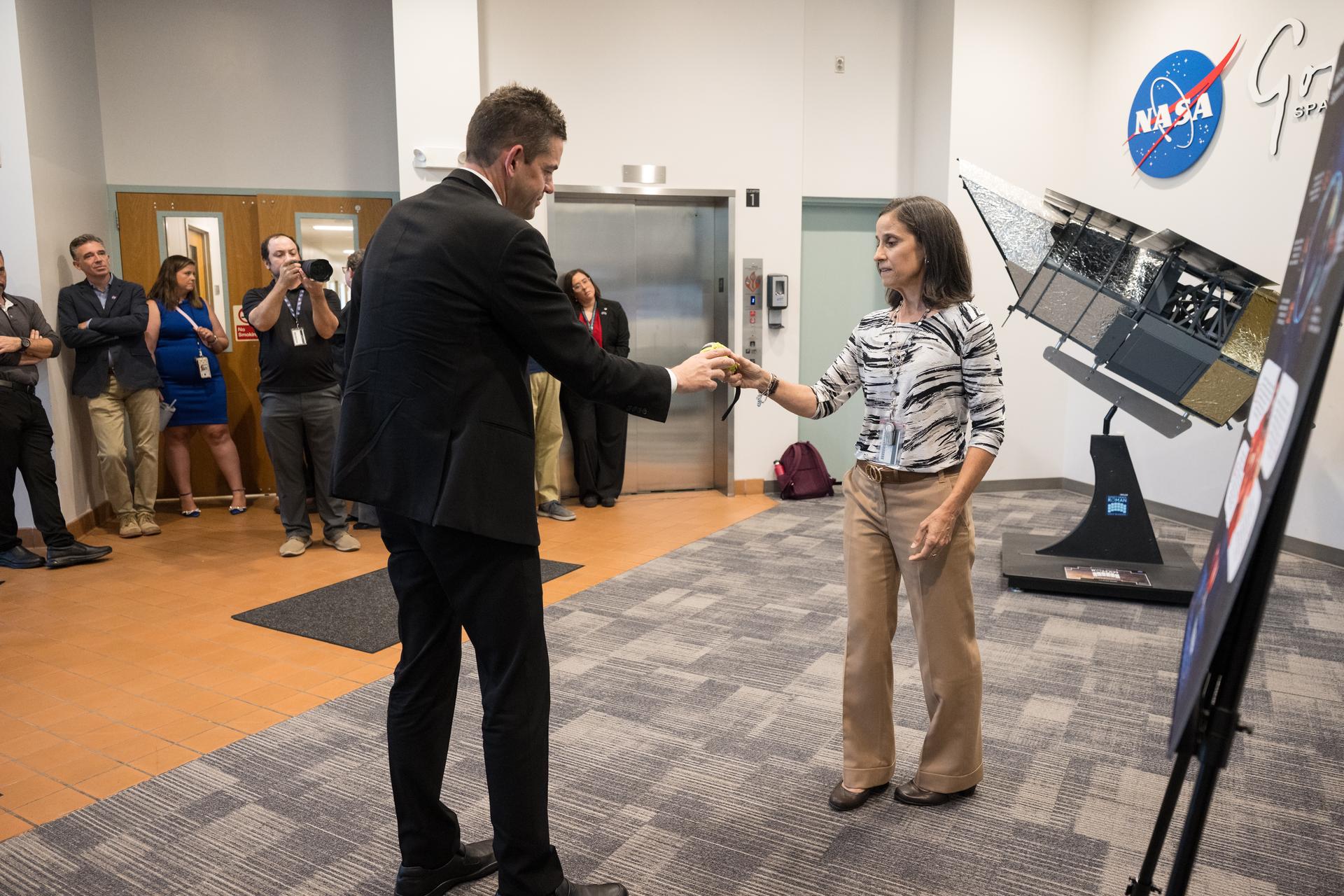 NASA Administrator Jared Isaacman, left, is shown examples of search and rescue technology by Search and Rescue Office Chief, Lisa Mazzuca during an event held to celebrate the launch of NASA’s Nancy Grace Roman Space Telescope, Tuesday, Sept. 1, 2026, at NASA’s Goddard Space Flight Center in Greenbelt, Maryland. Photo Credit: (NASA/Aubrey Gemignani)