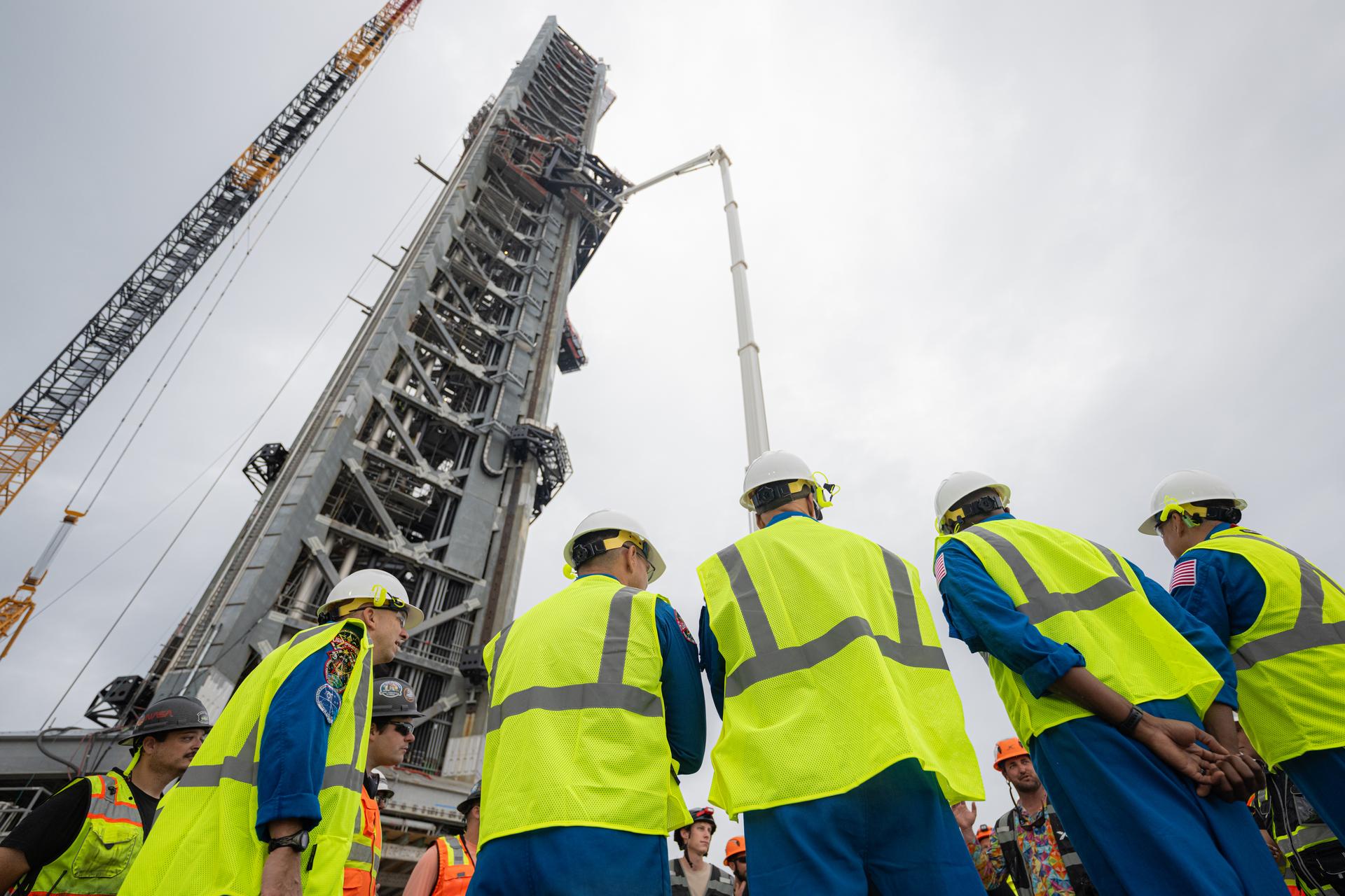 Artemis III crewmembers NASA astronauts Randy Bresnik, commander; Frank Rubio, mission specialist; European Space Agency astronaut Luca Parmitano, pilot; NASA astronauts Andre Douglas, mission specialist, and Bob Hines, backup crewmember, visit the Starship launch tower at Launch Complex 39A, Thursday, Sept. 3, 2026, at NASA’s Kennedy Space Center in Florida. Photo Credit: (NASA/John Kraus)
