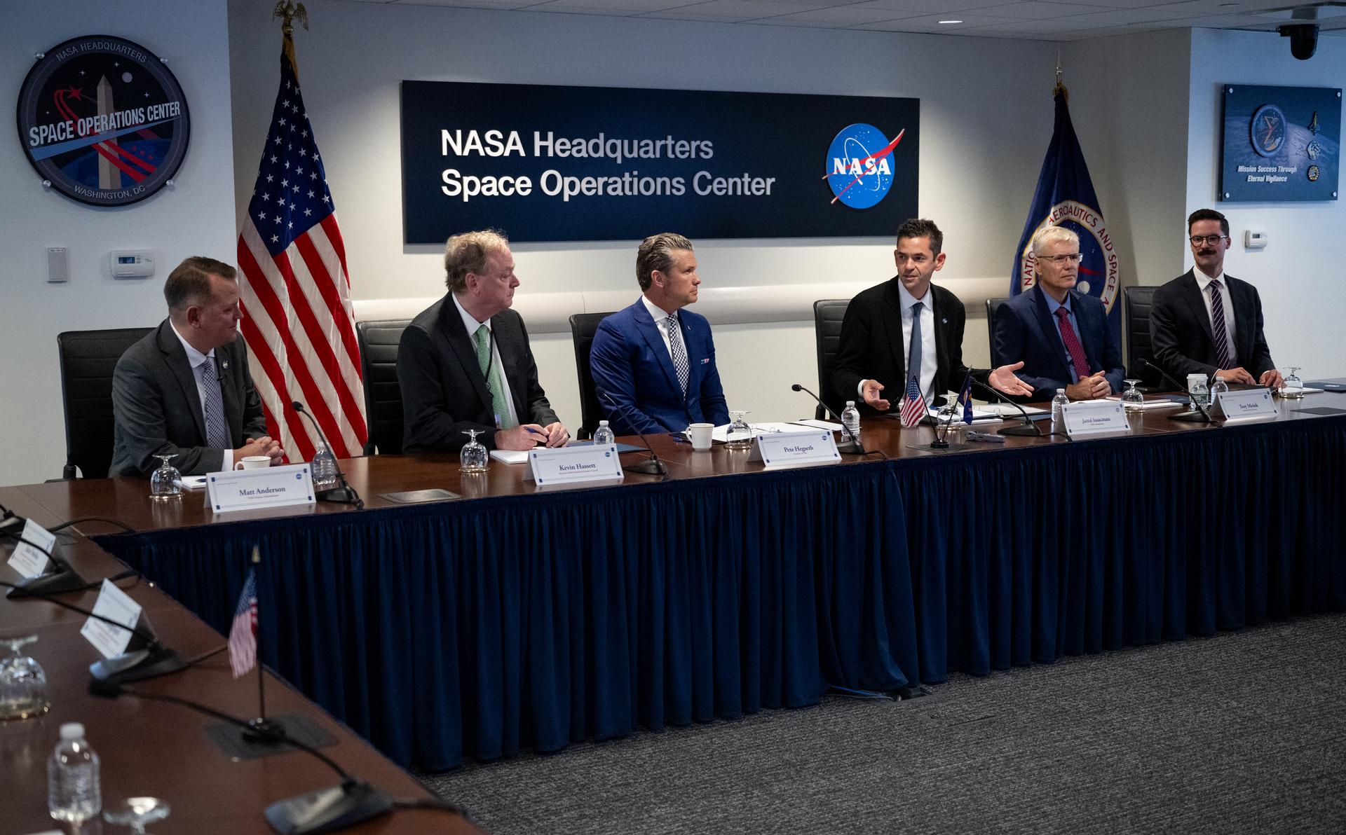 NASA Administrator Jared Isaacman, third from right, gives opening remarks alongside NASA Deputy Administrator Matt Anderson, left, Kevin Hassett, Director of the National Economic Council, second from left, Secretary of War Pete Hegseth, third from left, Troy Meink, Secretary of the United States Air Force, second from right, and Ethan Klein, U.S. Chief Technology Officer, right, during a meeting of the Presidential Commission on the United States Space Academy in the Space Operations Center, Wednesday, Sept. 9, 2026, at the Mary W. Jackson NASA Headquarters Building in Washington.  The commission will meet and submit a report proposing recommendations for the establishment of the Space Academy.  Photo Credit (NASA/Joel Kowsky)
