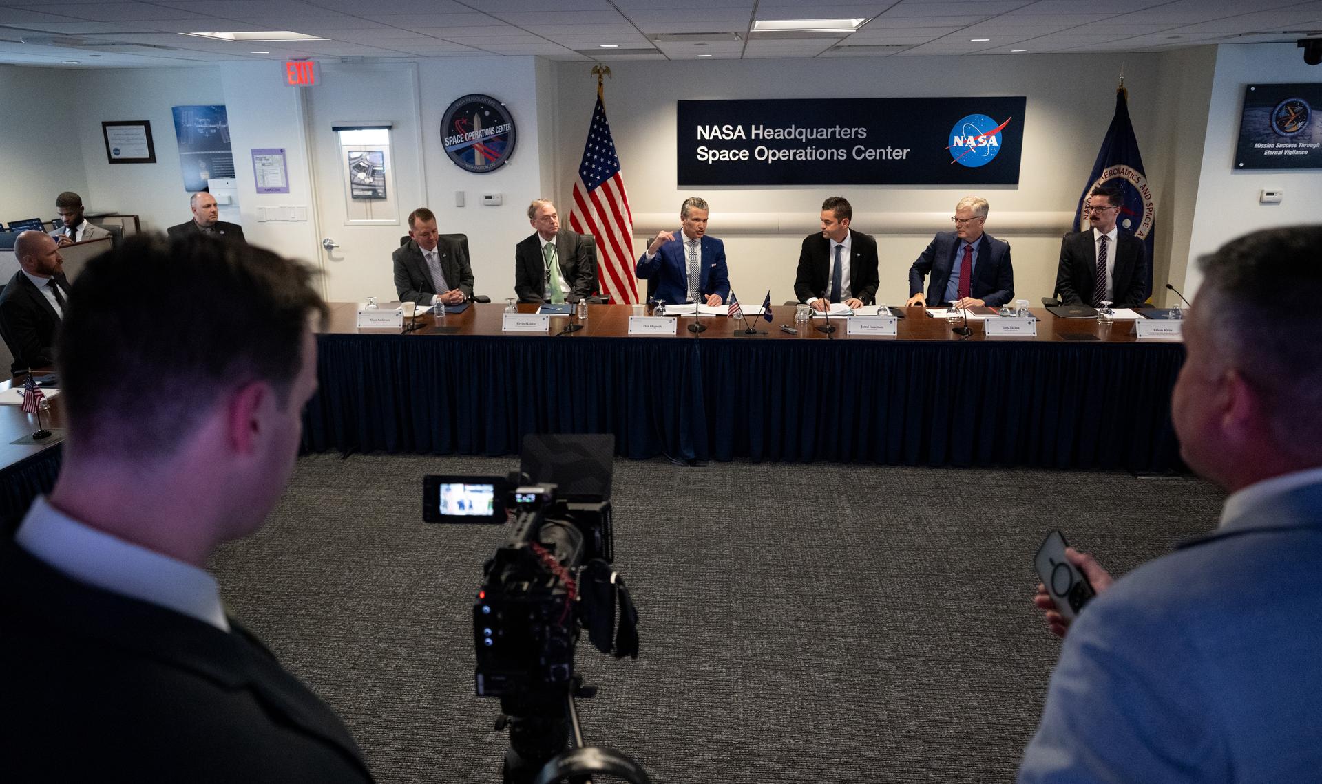 Secretary of War Pete Hegseth, third from left, gives opening remarks alongside NASA Deputy Administrator Matt Anderson, left, Kevin Hassett, Director of the National Economic Council, second from left, NASA Administrator Jared Isaacman, third from right, Troy Meink, Secretary of the United States Air Force, second from right, and Ethan Klein, U.S. Chief Technology Officer, right, during a meeting of the Presidential Commission on the United States Space Academy in the Space Operations Center, Wednesday, Sept. 9, 2026, at the Mary W. Jackson NASA Headquarters Building in Washington.  The commission will meet and submit a report proposing recommendations for the establishment of the Space Academy.  Photo Credit (NASA/Joel Kowsky)