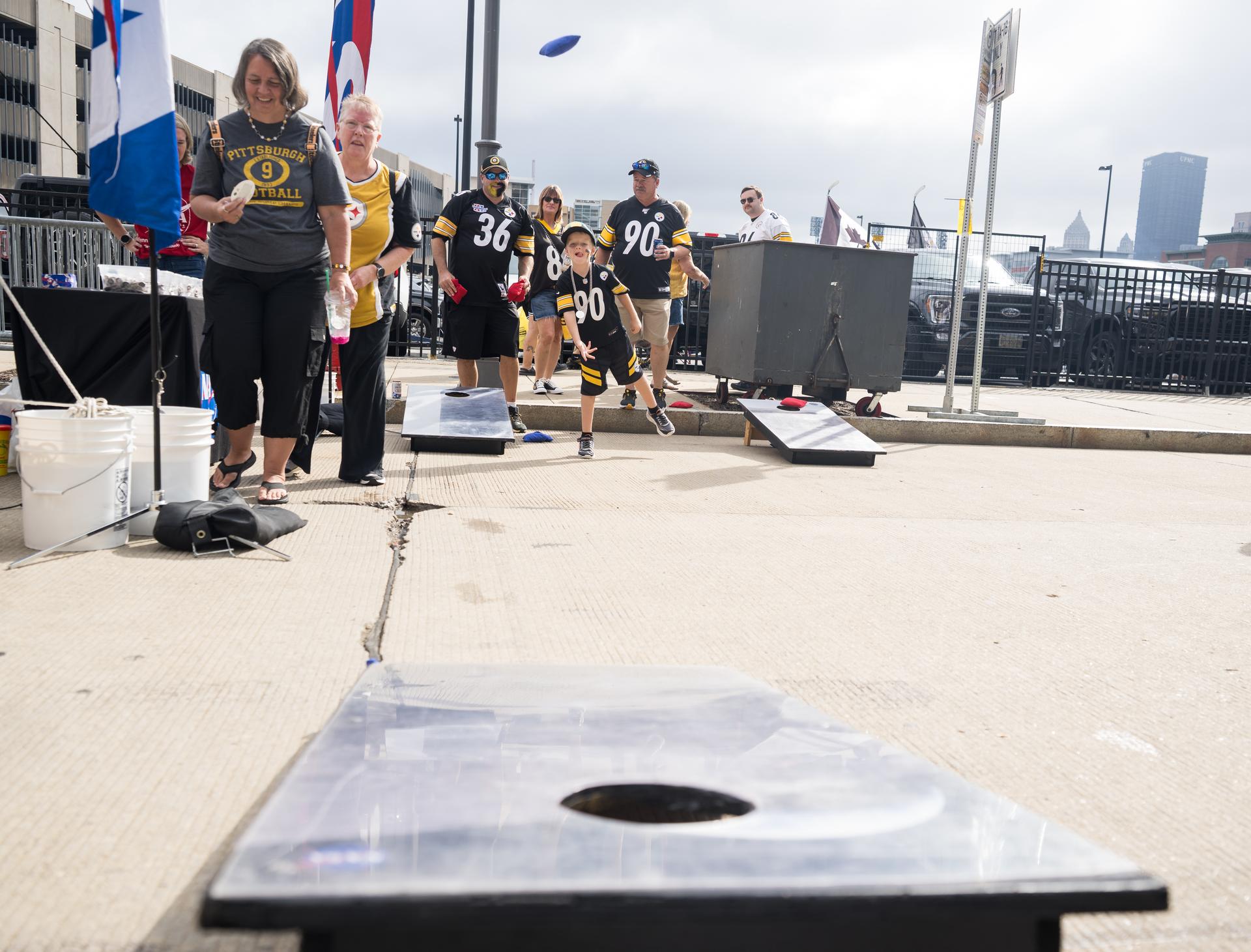 Fans play corn hole in the NASA Experience Zone at an NFL game between the Pittsburgh Steelers and the Atlanta Falcons at Acrisure Stadium, Sunday, Sept. 13, 2026, in Pittsburgh, Pennsylvania. NASA’s engagement at NFL games is part of the agency's Inspiration Tour, aimed at strengthening connections between NASA and its partners and showcasing innovation in air and space in the lead up to the MAX POWER aerospace technology expo and airshow at the agency's Kennedy Space Center in early November. Photo Credit: (NASA/Aubrey Gemignani)