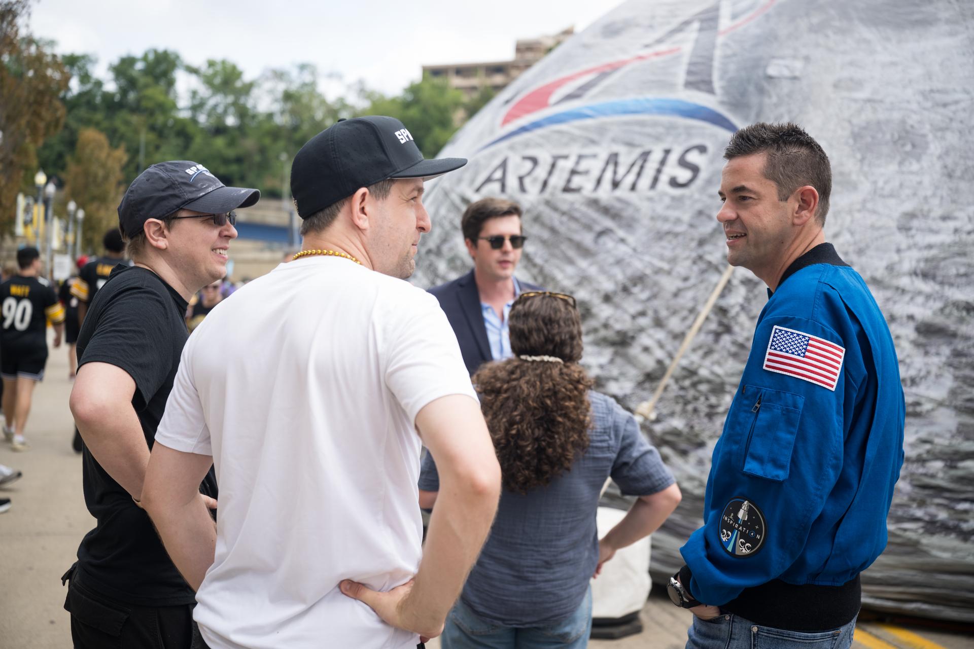 NASA Administrator Jared Isaacman greets fans outside the NASA Experience Zone at an NFL game between the Pittsburgh Steelers and the Atlanta Falcons at Acrisure Stadium, Sunday, Sept. 13, 2026, in Pittsburgh, Pennsylvania. NASA’s engagement at NFL games is part of the agency's Inspiration Tour, aimed at strengthening connections between NASA and its partners and showcasing innovation in air and space in the lead up to the MAX POWER aerospace technology expo and airshow at the agency's Kennedy Space Center in early November. Photo Credit: (NASA/Aubrey Gemignani)