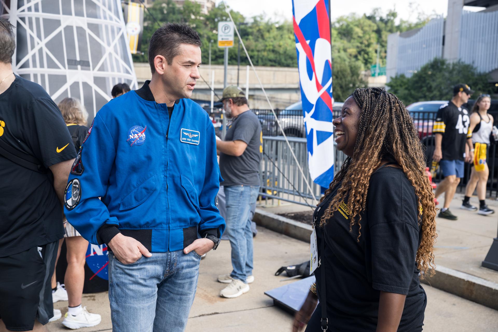 NASA Administrator Jared Isaacman greets fans outside the NASA Experience Zone at an NFL game between the Pittsburgh Steelers and the Atlanta Falcons at Acrisure Stadium, Sunday, Sept. 13, 2026, in Pittsburgh, Pennsylvania. NASA’s engagement at NFL games is part of the agency's Inspiration Tour, aimed at strengthening connections between NASA and its partners and showcasing innovation in air and space in the lead up to the MAX POWER aerospace technology expo and airshow at the agency's Kennedy Space Center in early November. Photo Credit: (NASA/Aubrey Gemignani)