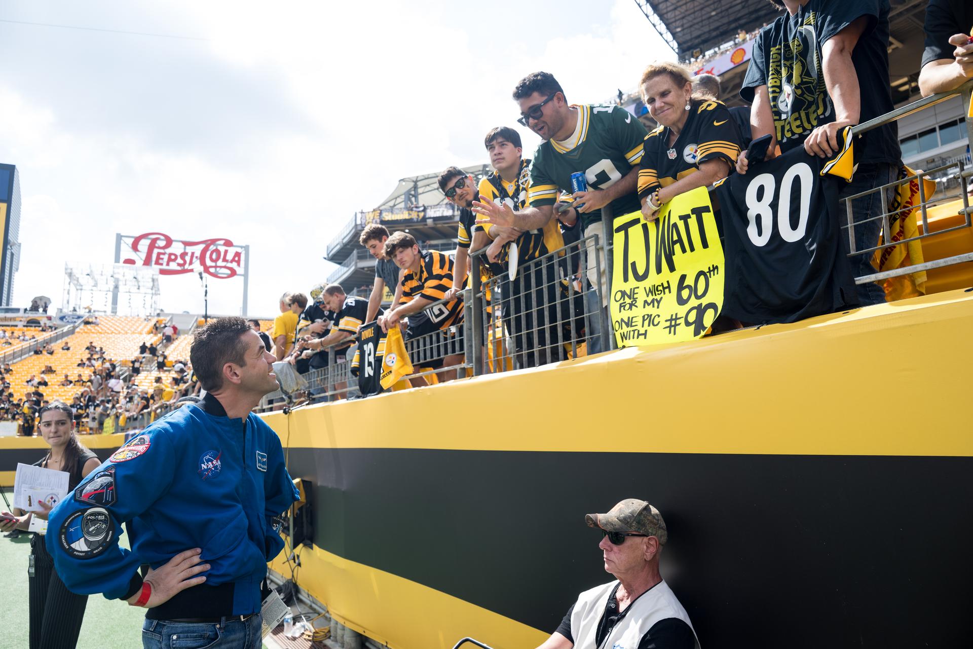 NASA Administrator Jared Isaacman greets fans at an NFL game between the Pittsburgh Steelers and the Atlanta Falcons at Acrisure Stadium, Sunday, Sept. 13, 2026, in Pittsburgh, Pennsylvania. NASA’s engagement at NFL games is part of the agency's Inspiration Tour, aimed at strengthening connections between NASA and its partners and showcasing innovation in air and space in the lead up to the MAX POWER aerospace technology expo and airshow at the agency's Kennedy Space Center in early November. Photo Credit: (NASA/Aubrey Gemignani)