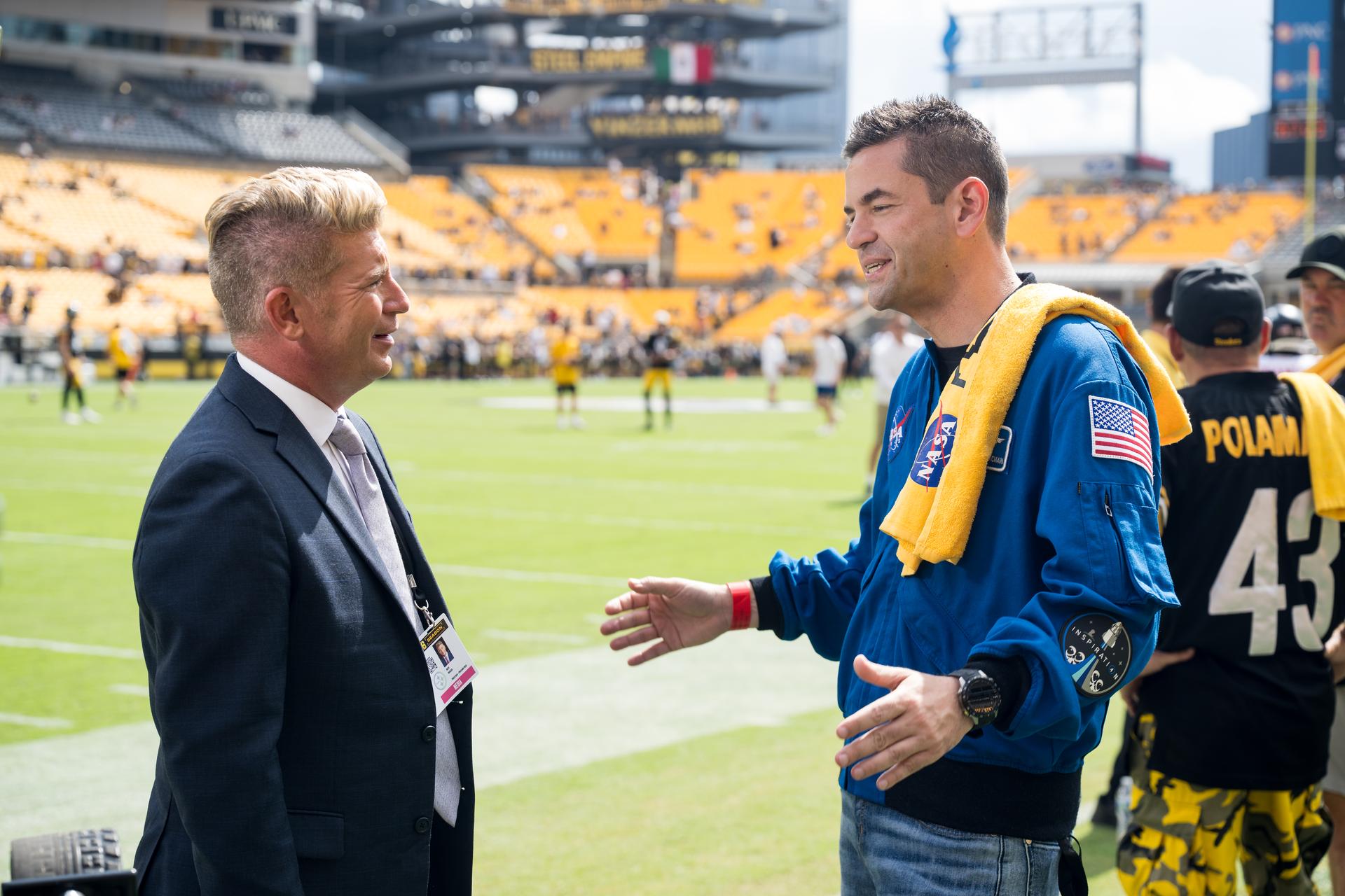 NASA Administrator Jared Isaacman is interviewed by media at an NFL game between the Pittsburgh Steelers and the Atlanta Falcons at Acrisure Stadium, Sunday, Sept. 13, 2026, in Pittsburgh, Pennsylvania. NASA’s engagement at NFL games is part of the agency's Inspiration Tour, aimed at strengthening connections between NASA and its partners and showcasing innovation in air and space in the lead up to the MAX POWER aerospace technology expo and airshow at the agency's Kennedy Space Center in early November. Photo Credit: (NASA/Aubrey Gemignani)