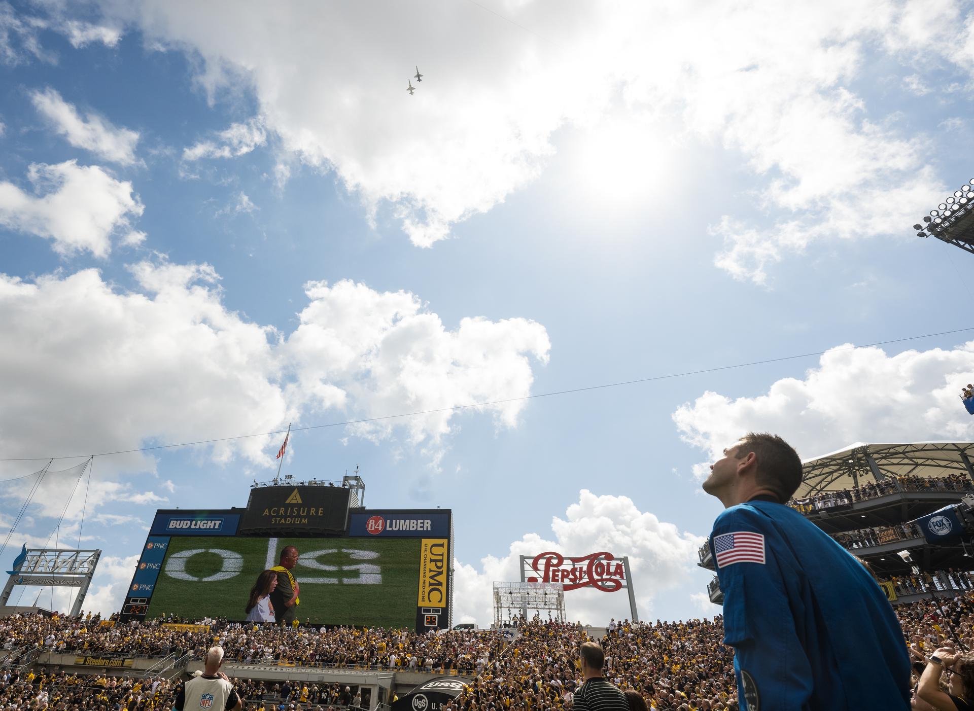 NASA Administrator Jared Isaacman watches as two NASA T-38 Talon aircrafts conduct a flyover at an NFL game between the Pittsburgh Steelers and the Atlanta Falcons at Acrisure Stadium, Sunday, Sept. 13, 2026, in Pittsburgh, Pennsylvania. NASA’s engagement at NFL games is part of the agency's Inspiration Tour, aimed at strengthening connections between NASA and its partners and showcasing innovation in air and space in the lead up to the MAX POWER aerospace technology expo and airshow at the agency's Kennedy Space Center in early November. Photo Credit: (NASA/Aubrey Gemignani)