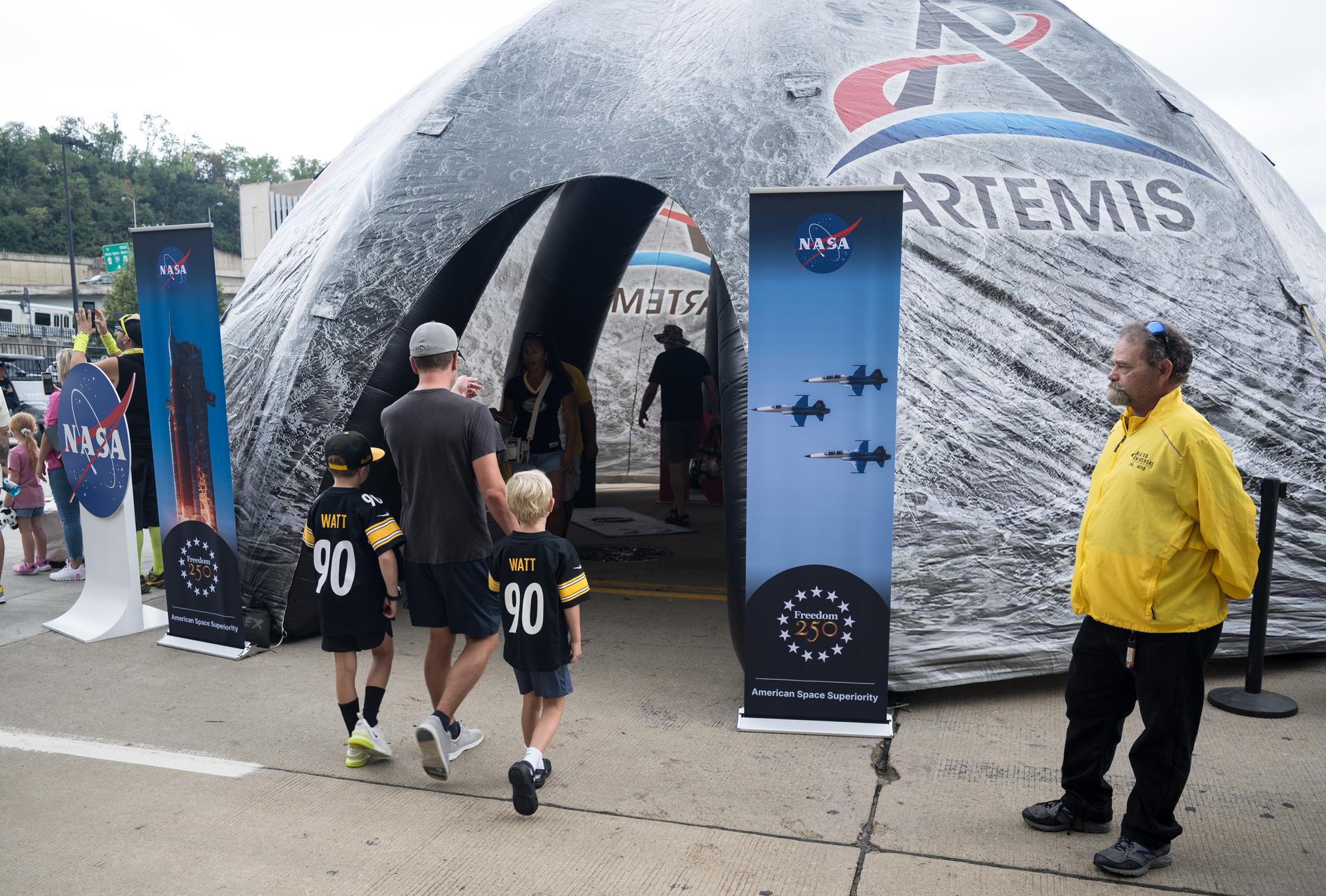 Fans enter the NASA Experience Zone at an NFL game between the Pittsburgh Steelers and the Atlanta Falcons at Acrisure Stadium, Sunday, Sept. 13, 2026, in Pittsburgh, Pennsylvania. NASA’s engagement at NFL games is part of the agency's Inspiration Tour, aimed at strengthening connections between NASA and its partners and showcasing innovation in air and space in the lead up to the MAX POWER aerospace technology expo and airshow at the agency's Kennedy Space Center in early November. Photo Credit: (NASA/Aubrey Gemignani)