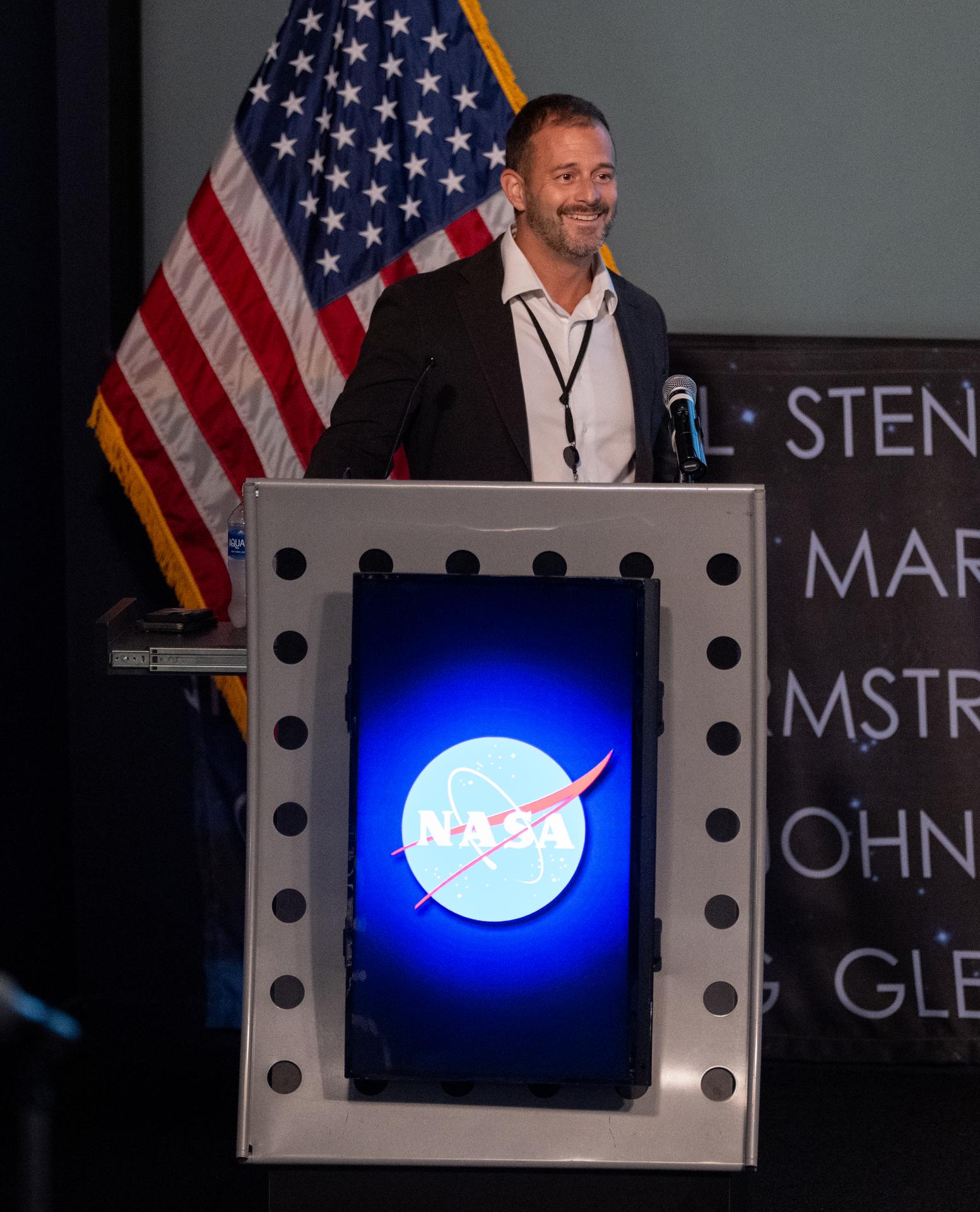 Stephen Zepecki, strategic communications manager for NASA’s Science Mission Directorate, introduces Dr. Lisa Carnell, director of NASA’s Biological and Physical Sciences Division, during a Frontiers Forum talk titled “Revolutionizing Medicine – In Space,” Wednesday, Sept. 16, 2026, at the Mary W. Jackson NASA Headquarters building in Washington.  Photo Credit: (NASA/Joel Kowsky)
