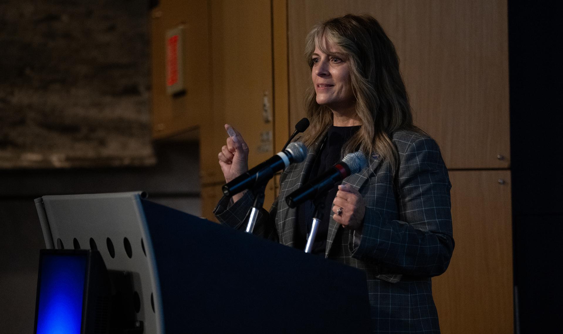 Dr. Lisa Carnell, director of NASA’s Biological and Physical Sciences Division, holds an organ chip during a Frontiers Forum talk titled “Revolutionizing Medicine – In Space,” as she discusses the AVATAR investigation, Wednesday, Sept. 16, 2026, at the Mary W. Jackson NASA Headquarters building in Washington. Photo Credit: (NASA/Joel Kowsky)