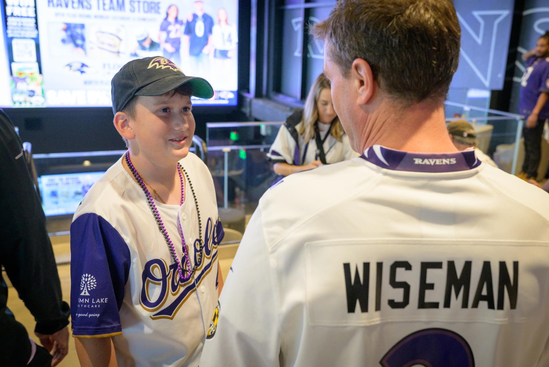 NASA astronaut and commander of the agency’s Artemis II mission, Reid Wiseman, a Baltimore native, meets with fans at an NFL game between the New Orleans Saints and the Baltimore Ravens at M&T Bank Stadium, Sunday, Sept. 20, 2026, in Baltimore. NASA’s engagement at NFL games is part of the agency's Inspiration Tour, aimed at strengthening connections between NASA and its partners and showcasing innovation in air and space in the lead up to the MAX POWER aerospace technology expo and airshow at the agency's Kennedy Space Center in early November. Photo Credit: (NASA/Bill Ingalls)