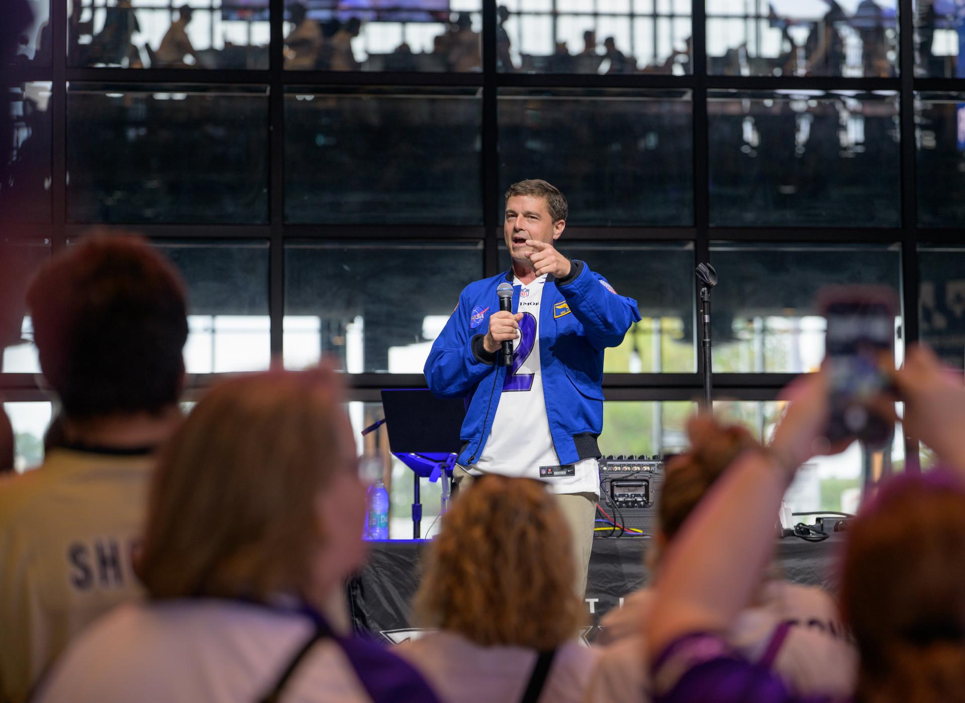 NASA astronaut and commander of the agency’s Artemis II mission, Reid Wiseman, a Baltimore native, talks to fans prior to the start of an NFL game between the New Orleans Saints and the Baltimore Ravens at M&T Bank Stadium, Sunday, Sept. 20, 2026, in Baltimore. NASA’s engagement at NFL games is part of the agency's Inspiration Tour, aimed at strengthening connections between NASA and its partners and showcasing innovation in air and space in the lead up to the MAX POWER aerospace technology expo and airshow at the agency's Kennedy Space Center in early November. Photo Credit: (NASA/Bill Ingalls)