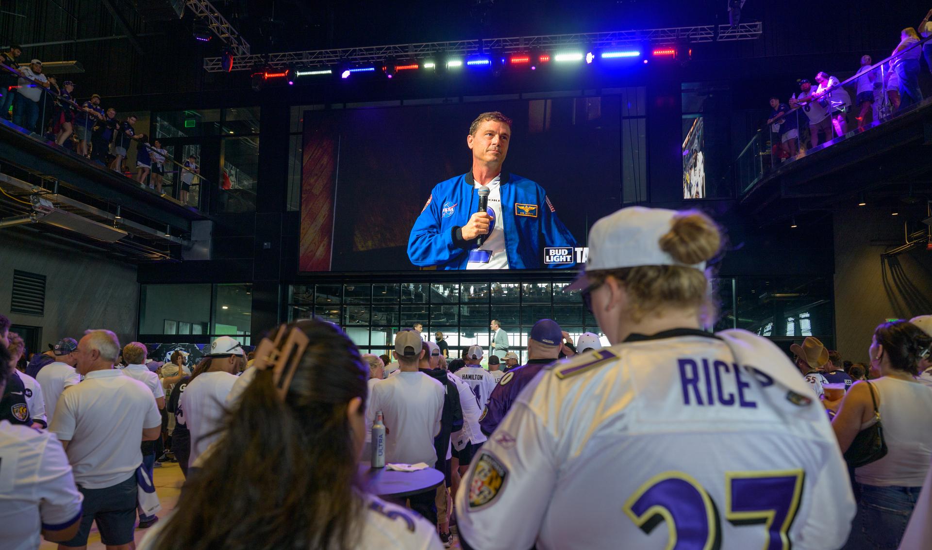 NASA astronaut and commander of the agency’s Artemis II mission, Reid Wiseman, a Baltimore native, talks to fans prior to the start of an NFL game between the New Orleans Saints and the Baltimore Ravens at M&T Bank Stadium, Sunday, Sept. 20, 2026, in Baltimore. NASA’s engagement at NFL games is part of the agency's Inspiration Tour, aimed at strengthening connections between NASA and its partners and showcasing innovation in air and space in the lead up to the MAX POWER aerospace technology expo and airshow at the agency's Kennedy Space Center in early November. Photo Credit: (NASA/Bill Ingalls)
