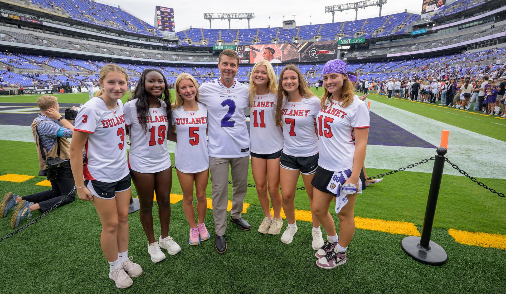 NASA astronaut and commander of the agency’s Artemis II mission, Reid Wiseman, a Baltimore native, poses for a photograph with students from Dulaney High School in Maryland at an NFL game between the New Orleans Saints and the Baltimore Ravens at M&T Bank Stadium, Sunday, Sept. 20, 2026, in Baltimore. NASA’s engagement at NFL games is part of the agency's Inspiration Tour, aimed at strengthening connections between NASA and its partners and showcasing innovation in air and space in the lead up to the MAX POWER aerospace technology expo and airshow at the agency's Kennedy Space Center in early November. Photo Credit: (NASA/Bill Ingalls)