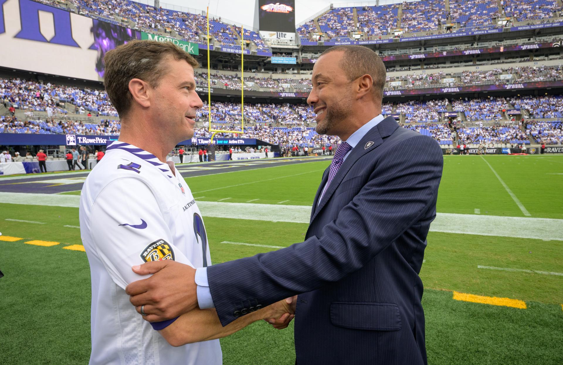 NASA astronaut and commander of the agency’s Artemis II mission, Reid Wiseman, a Baltimore native, left, shakes hands with Baltimore Ravens President Sashi Brown, at an NFL game between the New Orleans Saints and the Baltimore Ravens at M&T Bank Stadium, Sunday, Sept. 20, 2026, in Baltimore. NASA’s engagement at NFL games is part of the agency's Inspiration Tour, aimed at strengthening connections between NASA and its partners and showcasing innovation in air and space in the lead up to the MAX POWER aerospace technology expo and airshow at the agency's Kennedy Space Center in early November. Photo Credit: (NASA/Bill Ingalls)