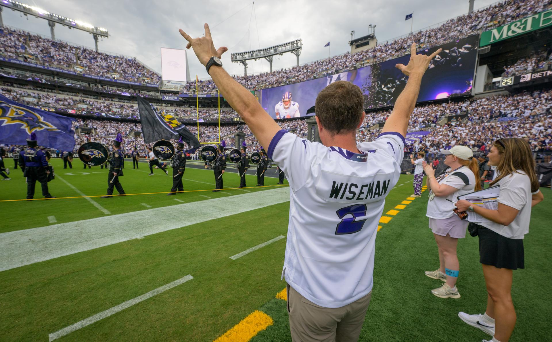 NASA astronaut and commander of the agency’s Artemis II mission, Reid Wiseman, a Baltimore native, celebrates as the Baltimore Ravens team is announced at an NFL game between the New Orleans Saints and the Ravens at M&T Bank Stadium, Sunday, Sept. 20, 2026, in Baltimore. NASA’s engagement at NFL games is part of the agency's Inspiration Tour, aimed at strengthening connections between NASA and its partners and showcasing innovation in air and space in the lead up to the MAX POWER aerospace technology expo and airshow at the agency's Kennedy Space Center in early November. Photo Credit: (NASA/Bill Ingalls)