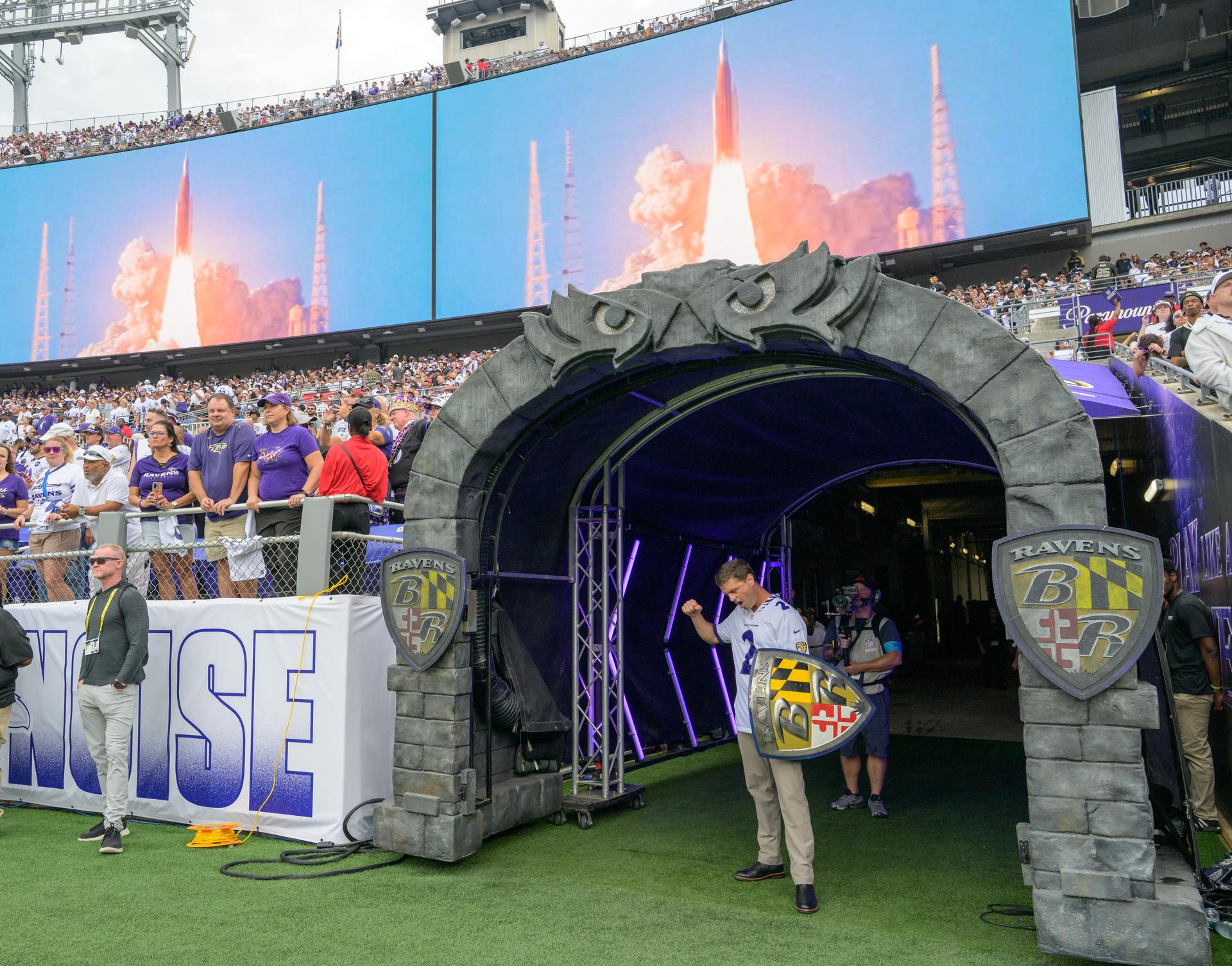 NASA astronaut and commander of the agency’s Artemis II mission, Reid Wiseman, a Baltimore native, leads “The Uprising”, a pregame show at an NFL game between the New Orleans Saints and the Baltimore Ravens at M&T Bank Stadium, Sunday, Sept. 20, 2026, in Baltimore. NASA’s engagement at NFL games is part of the agency's Inspiration Tour, aimed at strengthening connections between NASA and its partners and showcasing innovation in air and space in the lead up to the MAX POWER aerospace technology expo and airshow at the agency's Kennedy Space Center in early November. Photo Credit: (NASA/Bill Ingalls)
