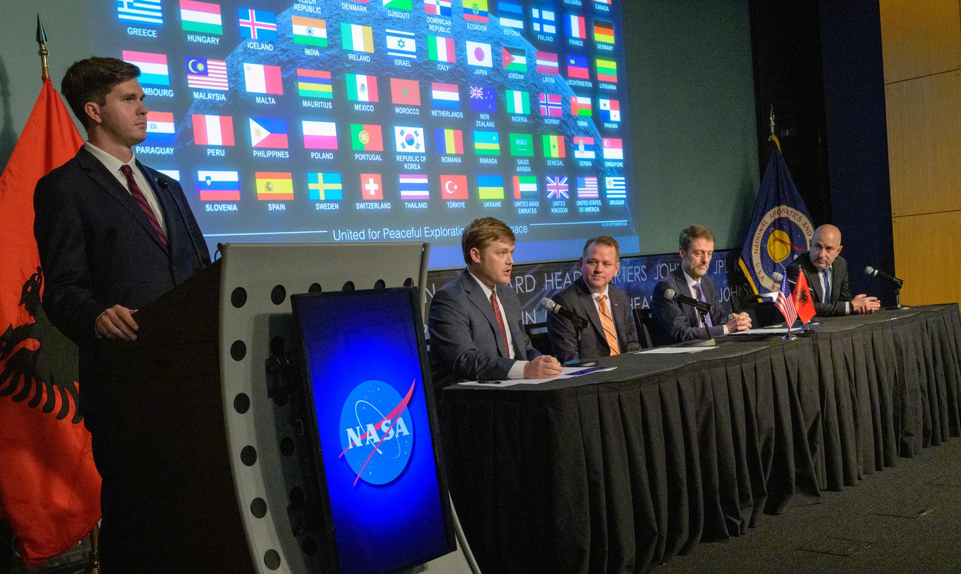 NASA Deputy Press Secretary George Alderman, standing left, U.S. Deputy Assistant Secretary of State for Space and Environment Connor Tomlinson, seated left, NASA Deputy Administrator Matt Anderson, Albania’s Minister for Europe and Foreign Affairs Ferit Hoxha, and Ambassador of the Republic of Albania to the United States Ervin Bushati, right, are seen during an Artemis Accords signing ceremony Monday, September 21, 2026, at the Mary W. Jackson NASA Headquarters building in Washington. The Republic of Albania is the 73rd country to sign the Artemis Accords, which establish a practical set of principles to guide space exploration cooperation among nations participating in NASA’s Artemis program. Photo Credit: (NASA/Bill Ingalls)