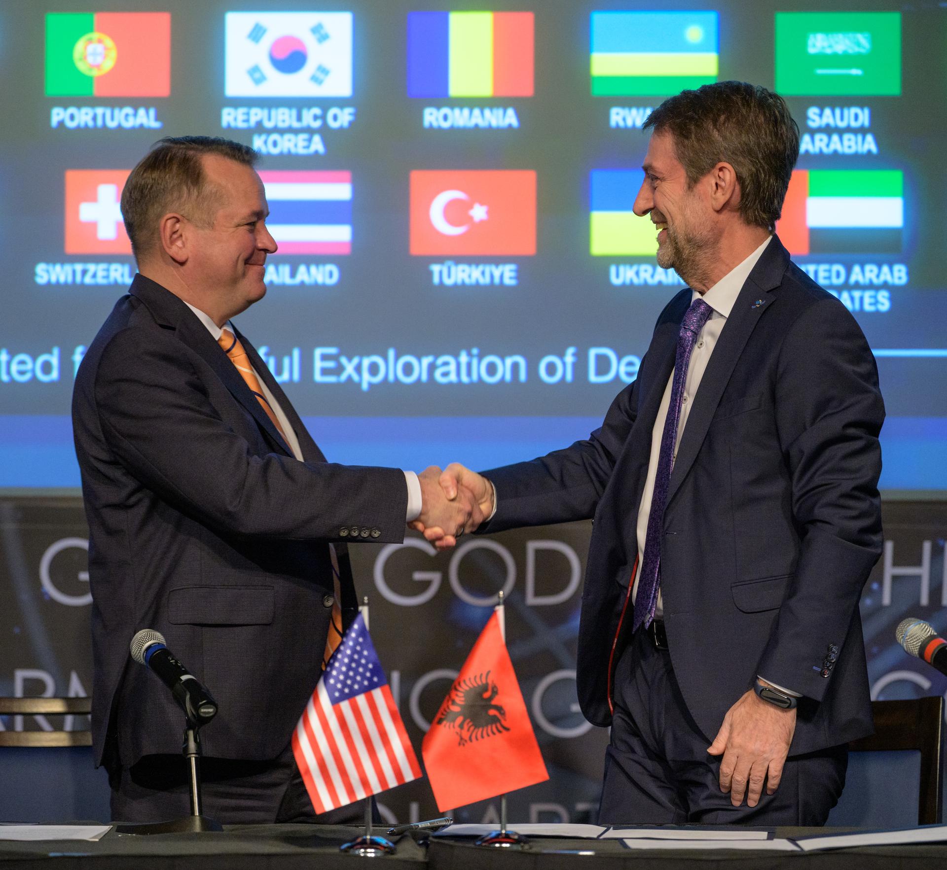 NASA Deputy Administrator Matt Anderson, left, shakes hands with Albania’s Minister for Europe and Foreign Affairs Ferit Hoxha after an Artemis Accords signing ceremony Monday, September 21, 2026, at the Mary W. Jackson NASA Headquarters building in Washington. Albania is the 73rd country to sign the Artemis Accords, which establish a practical set of principles to guide space exploration cooperation among nations participating in NASA’s Artemis program. Photo Credit: (NASA/Bill Ingalls)