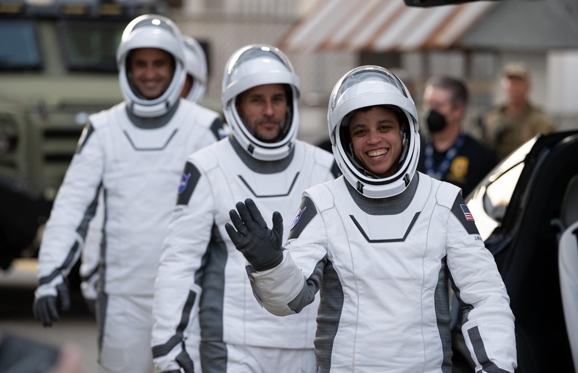 NASA astronaut Jessica Watkins waves as she and fellow crewmates NASA astronaut Luke Delaney, Roscosmos cosmonaut Sergey Teteryatnikov, and CSA (Canadian Space Agency) astronaut Joshua Kutryk, wearing SpaceX spacesuits, are seen as they prepare to depart the Neil  A. Armstrong Operations and Checkout Building for Space Launch Complex 40 on Cape Canaveral Space Force Station during a dress rehearsal prior to the Crew-13 mission launch, Tuesday, Sept. 29, 2026, at NASA’s Kennedy Space Center in Florida. NASA’s SpaceX Crew-13 mission is the 13th crew rotation mission of the SpaceX Dragon spacecraft and Falcon 9 rocket to the International Space Station as part of the agency’s Commercial Crew Program. Watkins, Delaney, Kutryk, Teteryatnikov are scheduled to launch at 11:10 a.m. EDT on Thursday, Oct. 1, from Space Launch Complex 40 at the Cape Canaveral Space Force Station. Photo Credit: (NASA/Joel Kowsky)