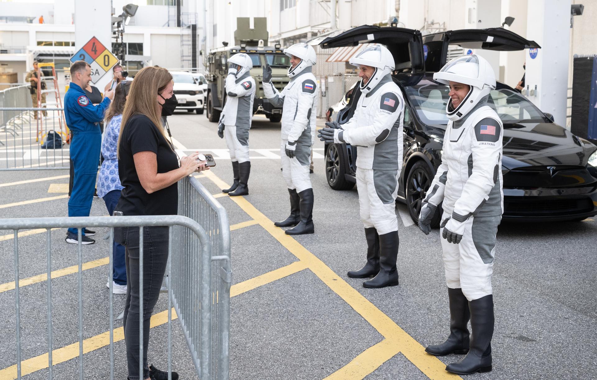 NASA astronauts Jessica Watkins, right, Luke Delaney, Roscosmos cosmonaut Sergey Teteryatnikov, and CSA (Canadian Space Agency) astronaut Joshua Kutryk, wearing SpaceX spacesuits, are seen as they prepare to depart the Neil  A. Armstrong Operations and Checkout Building for Space Launch Complex 40 on Cape Canaveral Space Force Station during a dress rehearsal prior to the Crew-13 mission launch, Tuesday, Sept. 29, 2026, at NASA’s Kennedy Space Center in Florida. NASA’s SpaceX Crew-13 mission is the 13th crew rotation mission of the SpaceX Dragon spacecraft and Falcon 9 rocket to the International Space Station as part of the agency’s Commercial Crew Program. Watkins, Delaney, Kutryk, Teteryatnikov are scheduled to launch at 11:10 a.m. EDT on Thursday, Oct. 1, from Space Launch Complex 40 at the Cape Canaveral Space Force Station. Photo Credit: (NASA/Joel Kowsky)
