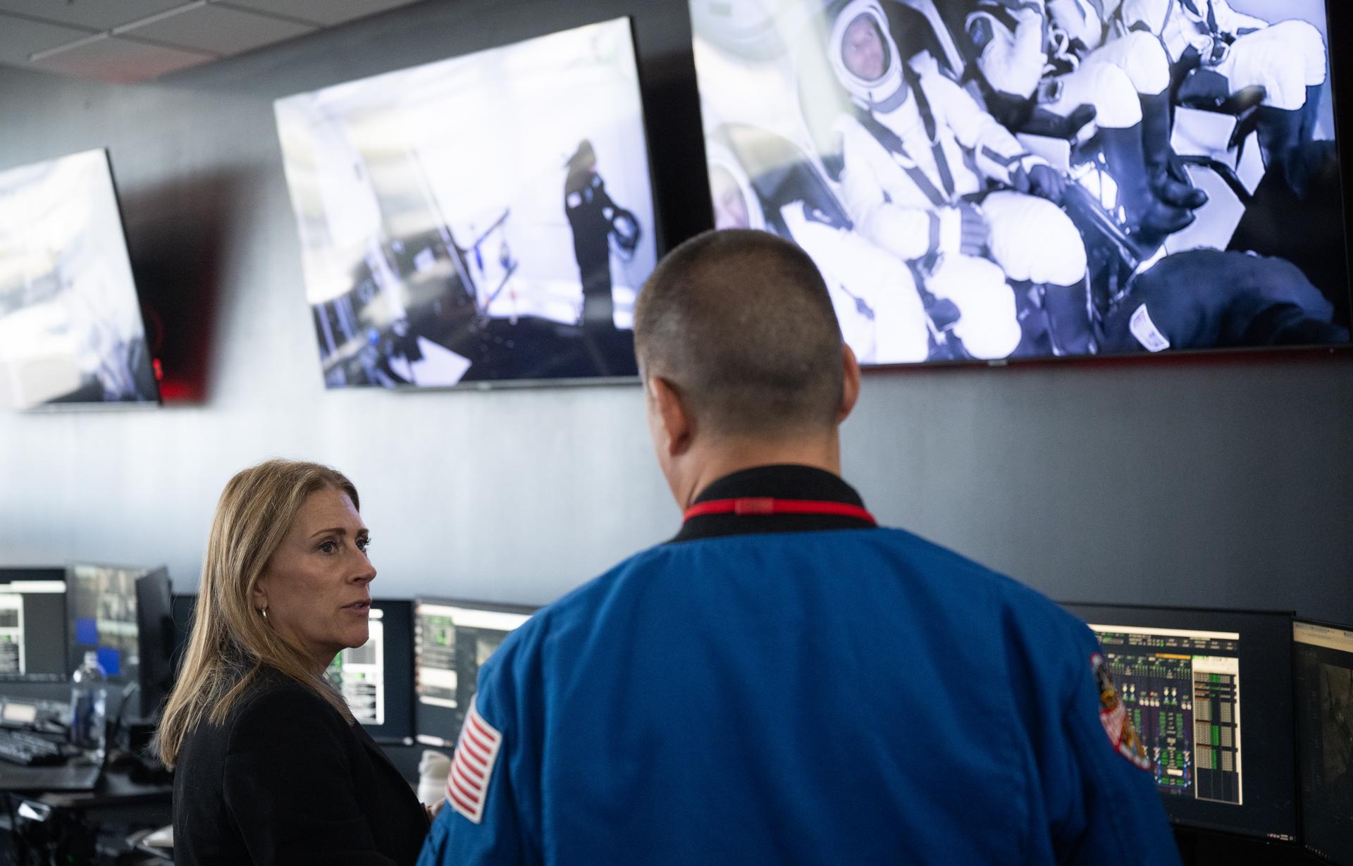 Dana Weigel, manager of NASA’s Low Earth Orbit Program, speaks with Kjell Lindgren deputy director of Flight Operations at NASA’s Johnson Space Center as teams monitor the countdown during a dress rehearsal in preparation for the launch of a SpaceX Falcon 9 rocket carrying the company's Dragon spacecraft on NASA’s SpaceX Crew-13 mission with NASA astronauts Jessica Watkins and Luke Delaney, CSA (Canadian Space Agency) astronaut Joshua Kutryk, and Roscosmos cosmonaut Sergey Teteryatnikov onboard, Tuesday, Sept. 29, 2026, in the control room of SpaceX’s HangarX at NASA’s Kennedy Space Center in Florida. NASA’s SpaceX Crew-13 mission is the 13th crew rotation mission of the SpaceX Dragon spacecraft and Falcon 9 rocket to the International Space Station as part of the agency’s Commercial Crew Program. Watkins, Delaney, Kutryk, Teteryatnikov are scheduled to launch on 11:10 a.m. EDT on Thursday, Oct. 1, from Space Launch Complex 40 at the Cape Canaveral Space Force Station. Photo Credit: (NASA/Joel Kowsky)