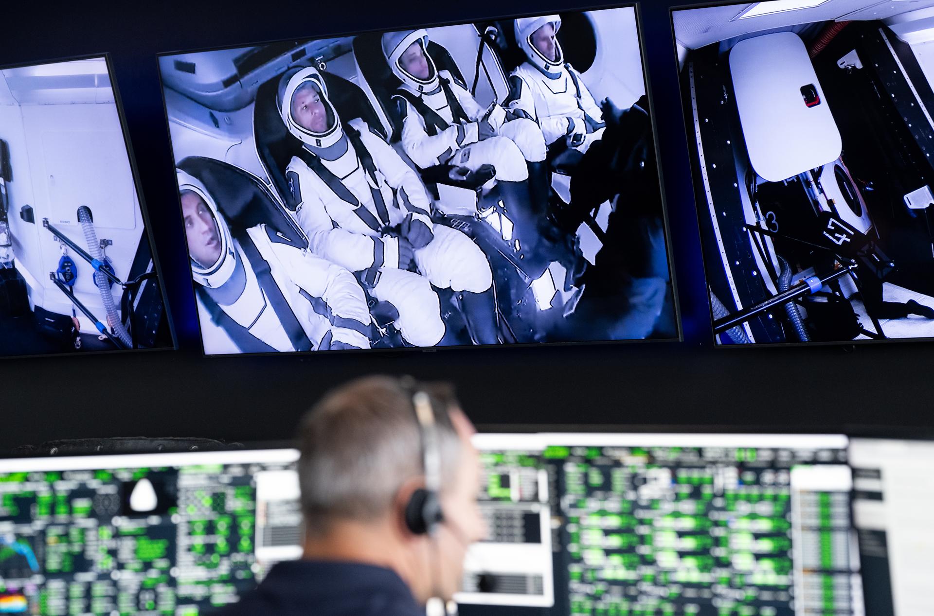 Roscosmos cosmonaut Sergey Teteryatnikov, left, NASA astronauts Luke Delaney and Jessica Watkins, and CSA (Canadian Space Agency) astronaut Joshua Kutryk, are seen on a monitor inside their Dragon spacecraft as teams monitor the countdown during a dress rehearsal in preparation for the launch of a SpaceX Falcon 9 rocket carrying the company's Dragon spacecraft on NASA’s SpaceX Crew-13 mission with NASA astronauts Jessica Watkins and Luke Delaney, CSA (Canadian Space Agency) astronaut Joshua Kutryk, and Roscosmos cosmonaut Sergey Teteryatnikov onboard, Tuesday, Sept. 29, 2026, in the control room of SpaceX’s HangarX at NASA’s Kennedy Space Center in Florida. NASA’s SpaceX Crew-13 mission is the 13th crew rotation mission of the SpaceX Dragon spacecraft and Falcon 9 rocket to the International Space Station as part of the agency’s Commercial Crew Program. Watkins, Delaney, Kutryk, Teteryatnikov are scheduled to launch on 11:10 a.m. EDT on Thursday, Oct. 1, from Space Launch Complex 40 at the Cape Canaveral Space Force Station. Photo Credit: (NASA/Joel Kowsky)