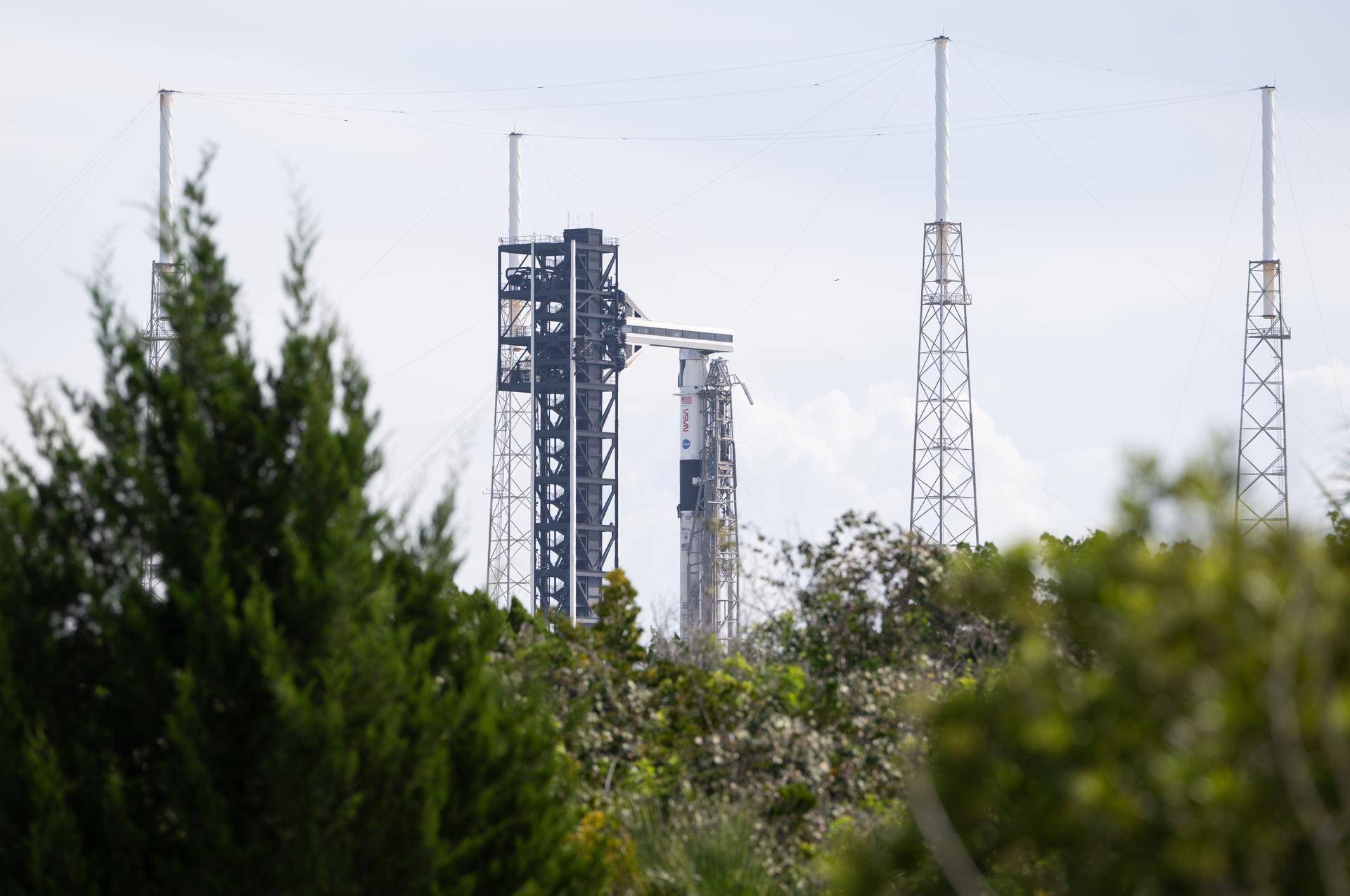 A SpaceX Falcon 9 rocket with the company's Dragon spacecraft on top is seen on the launch pad at Space Launch Complex 40 as preparations continue for the Crew-13 mission, Wednesday, Sept. 30, 2026, at Cape Canaveral Space Force Station in Florida. NASA’s SpaceX Crew-13 mission is the 13th crew rotation mission of the SpaceX Dragon spacecraft and Falcon 9 rocket to the International Space Station as part of the agency’s Commercial Crew Program. NASA astronauts Jessica Watkins and Luke Delaney, CSA (Canadian Space Agency) astronaut Joshua Kutryk, and Roscosmos cosmonaut Sergey Teteryatnikov are scheduled to launch at 11:10 a.m. EDT on Thursday, Oct. 1, from Space Launch Complex 40 at the Cape Canaveral Space Force Station. Photo Credit: (NASA/Joel Kowsky)