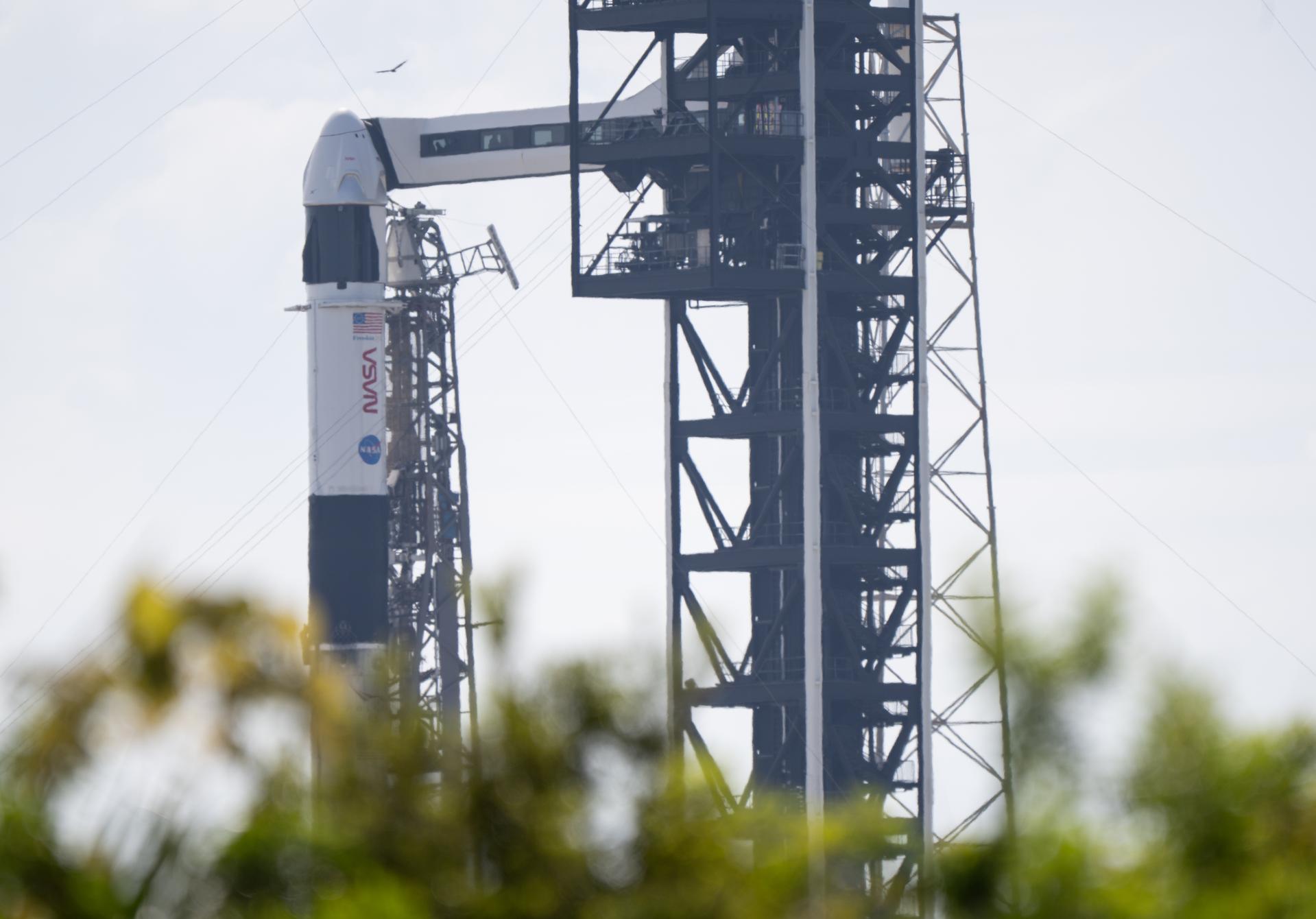 A SpaceX Falcon 9 rocket with the company's Dragon spacecraft on top is seen on the launch pad at Space Launch Complex 40 as preparations continue for the Crew-13 mission, Wednesday, Sept. 30, 2026, at Cape Canaveral Space Force Station in Florida. NASA’s SpaceX Crew-13 mission is the 13th crew rotation mission of the SpaceX Dragon spacecraft and Falcon 9 rocket to the International Space Station as part of the agency’s Commercial Crew Program. NASA astronauts Jessica Watkins and Luke Delaney, CSA (Canadian Space Agency) astronaut Joshua Kutryk, and Roscosmos cosmonaut Sergey Teteryatnikov are scheduled to launch at 11:10 a.m. EDT on Thursday, Oct. 1, from Space Launch Complex 40 at the Cape Canaveral Space Force Station. Photo Credit: (NASA/Joel Kowsky)