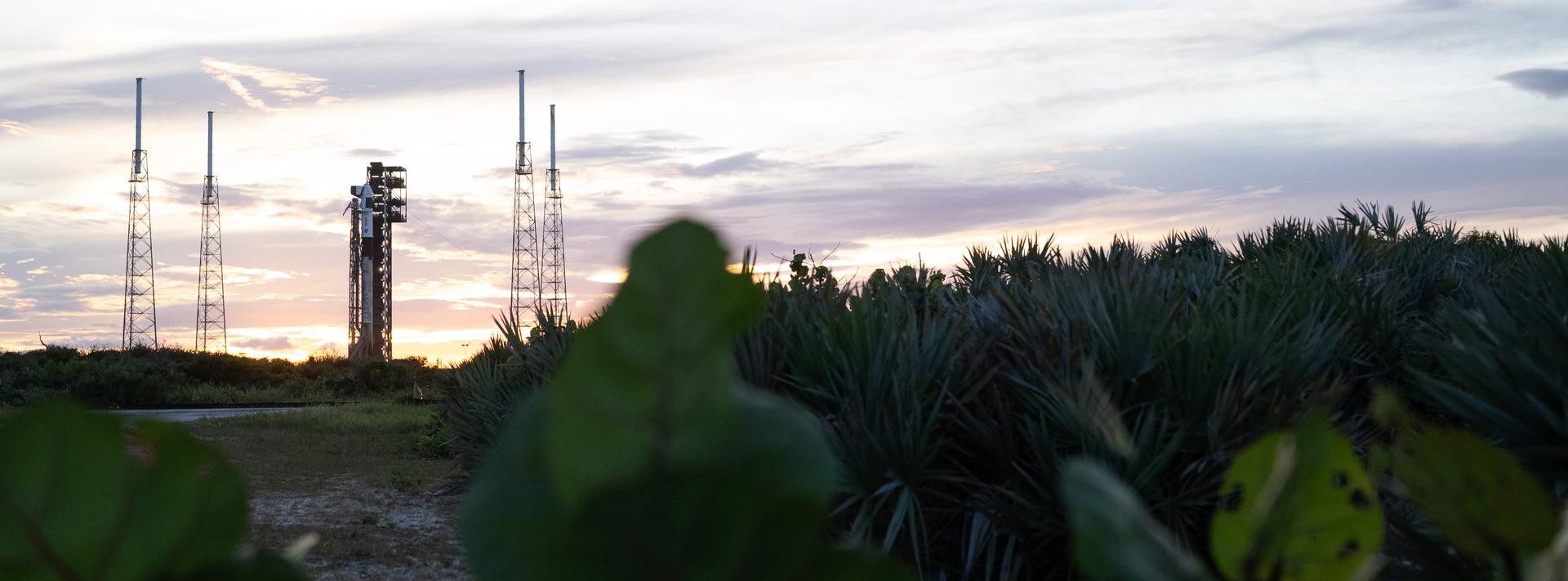 A SpaceX Falcon 9 rocket with the company's Dragon spacecraft on top is seen at sunset on the launch pad at Space Launch Complex 40 as preparations continue for the Crew-13 mission, Wednesday, Sept. 30, 2026, at Cape Canaveral Space Force Station in Florida. NASA’s SpaceX Crew-13 mission is the 13th crew rotation mission of the SpaceX Dragon spacecraft and Falcon 9 rocket to the International Space Station as part of the agency’s Commercial Crew Program. NASA astronauts Jessica Watkins and Luke Delaney, CSA (Canadian Space Agency) astronaut Joshua Kutryk, and Roscosmos cosmonaut Sergey Teteryatnikov are scheduled to launch at 11:10 a.m. EDT on Thursday, Oct. 1, from Space Launch Complex 40 at the Cape Canaveral Space Force Station. Photo Credit: (NASA/Joel Kowsky)