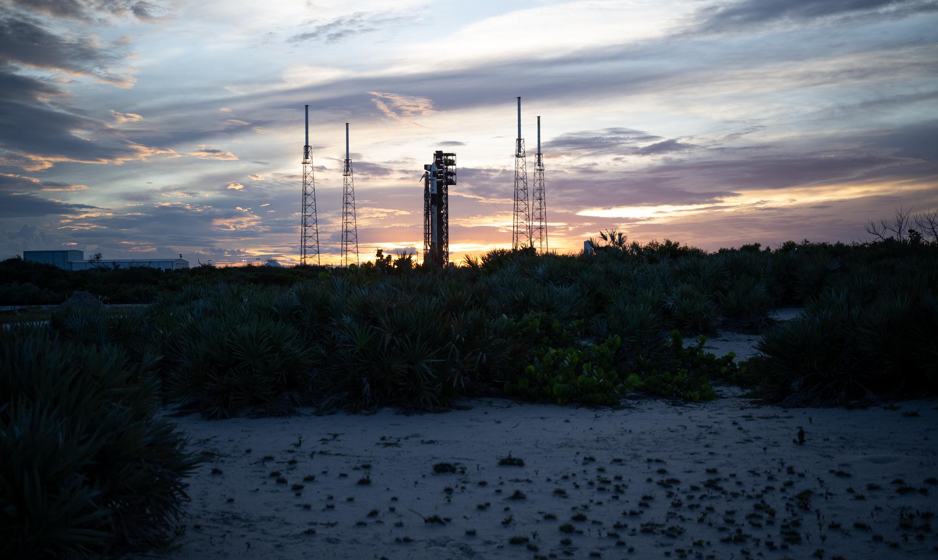 A SpaceX Falcon 9 rocket with the company's Dragon spacecraft on top is seen at sunset on the launch pad at Space Launch Complex 40 as preparations continue for the Crew-13 mission, Wednesday, Sept. 30, 2026, at Cape Canaveral Space Force Station in Florida. NASA’s SpaceX Crew-13 mission is the 13th crew rotation mission of the SpaceX Dragon spacecraft and Falcon 9 rocket to the International Space Station as part of the agency’s Commercial Crew Program. NASA astronauts Jessica Watkins and Luke Delaney, CSA (Canadian Space Agency) astronaut Joshua Kutryk, and Roscosmos cosmonaut Sergey Teteryatnikov are scheduled to launch at 11:10 a.m. EDT on Thursday, Oct. 1, from Space Launch Complex 40 at the Cape Canaveral Space Force Station. Photo Credit: (NASA/Joel Kowsky)