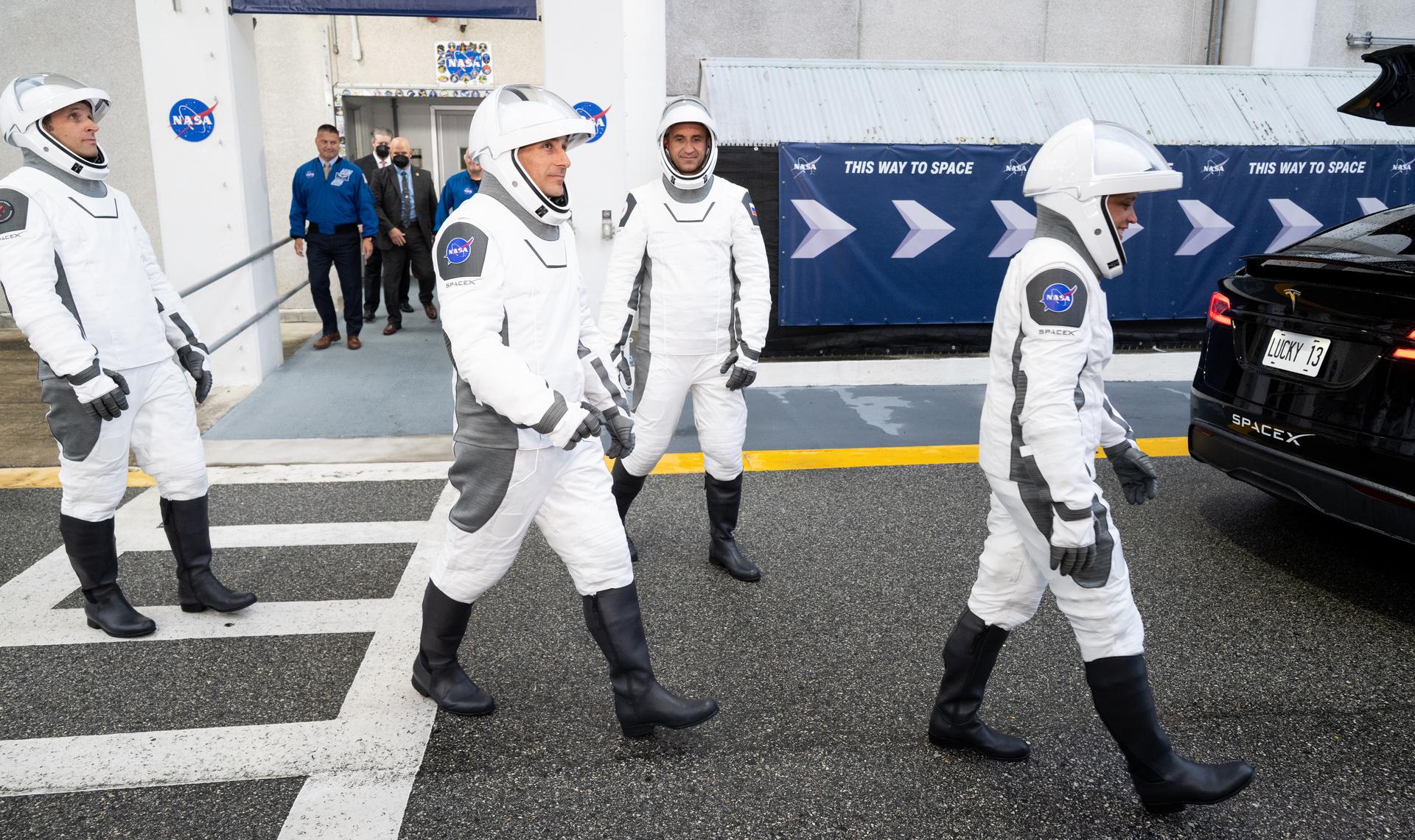 CSA (Canadian Space Agency) astronaut Joshua Kutryk, left, NASA astronaut Luke Delaney, Roscosmos cosmonaut Sergey Teteryatnikov, and NASA astronaut Jessica Watkins, wearing SpaceX spacesuits, are seen as they prepare to depart the Neil  A. Armstrong Operations and Checkout Building for Space Launch Complex 40 on Cape Canaveral Space Force Station to board the SpaceX Dragon spacecraft for the Crew-13 mission launch, Thursday, Oct. 1, 2026, at NASA’s Kennedy Space Center in Florida. NASA’s SpaceX Crew-13 mission is the 13th crew rotation mission of the SpaceX Dragon spacecraft and Falcon 9 rocket to the International Space Station as part of the agency’s Commercial Crew Program. Watkins, Delaney, Kutryk, Teteryatnikov are scheduled to launch at 11:10 a.m. EDT, from Space Launch Complex 40 at the Cape Canaveral Space Force Station.  Photo Credit: (NASA/Joel Kowsky)