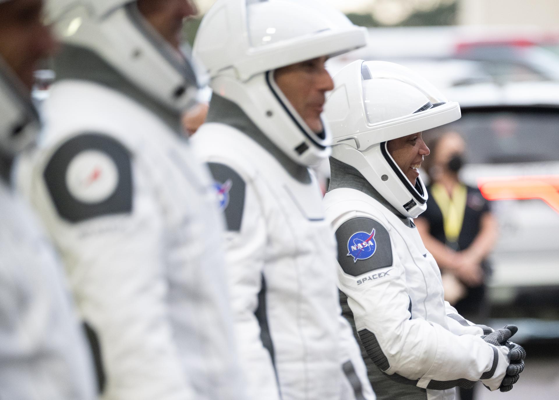 NASA astronaut Jessica Watkins is seen alongside fellow crewmates Luke Delaney, CSA (Canadian Space Agency) astronaut Joshua Kutryk, and Roscosmos cosmonaut Sergey Teteryatnikov, wearing SpaceX spacesuits, as they prepare to depart the Neil  A. Armstrong Operations and Checkout Building for Space Launch Complex 40 on Cape Canaveral Space Force Station to board the SpaceX Dragon spacecraft for the Crew-13 mission launch, Thursday, Oct. 1, 2026, at NASA’s Kennedy Space Center in Florida. NASA’s SpaceX Crew-13 mission is the 13th crew rotation mission of the SpaceX Crew Dragon spacecraft and Falcon 9 rocket to the International Space Station as part of the agency’s Commercial Crew Program. Watkins, Delaney, Kutryk, Teteryatnikov are scheduled to launch at 11:10 a.m. EDT, from Space Launch Complex 40 at the Cape Canaveral Space Force Station.  Photo Credit: (NASA/Joel Kowsky)