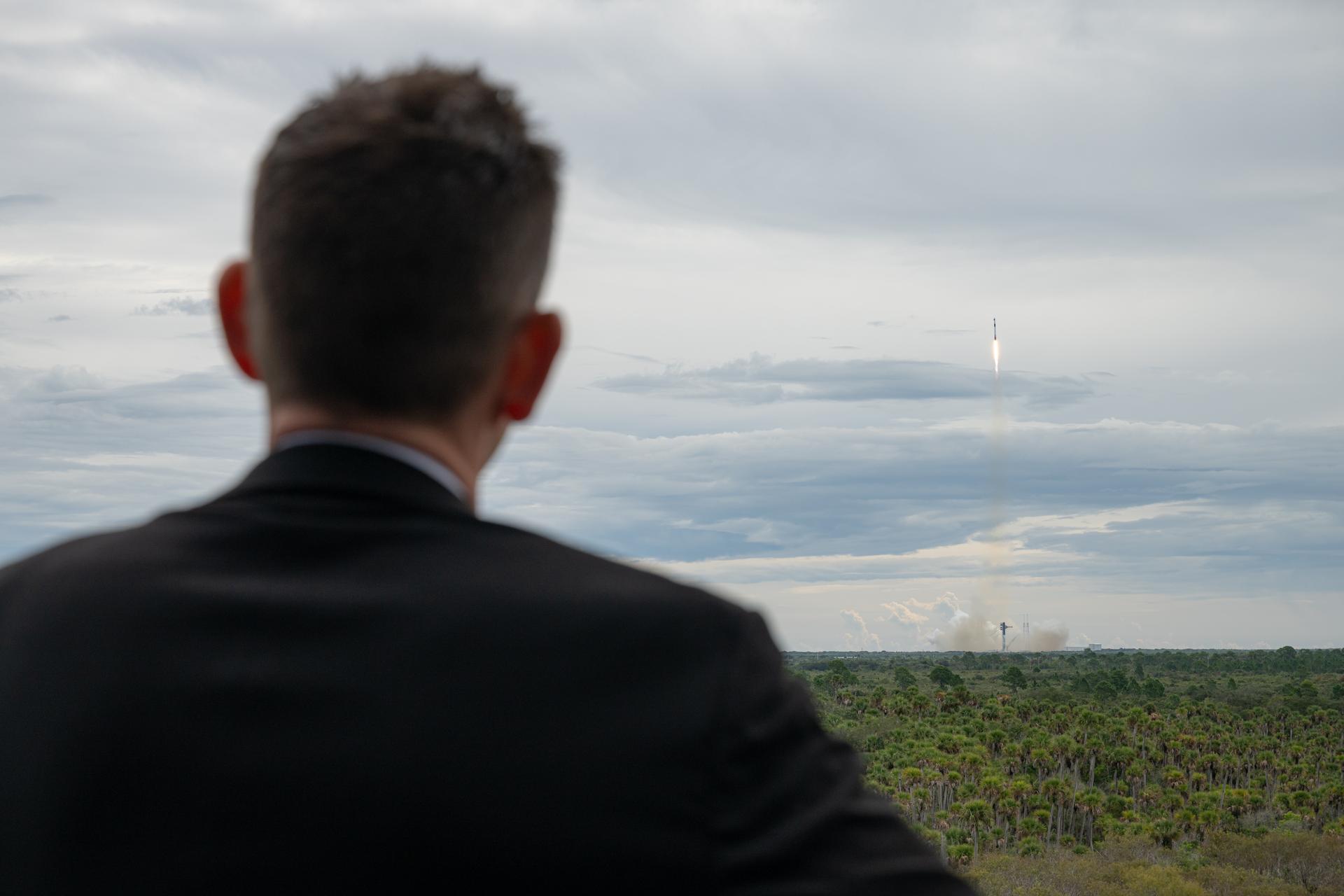 NASA Administrator Jared Isaacman watches as a SpaceX Falcon 9 rocket carrying the company’s Dragon spacecraft launches on NASA’s SpaceX Crew-13 mission to the International Space Station with NASA astronauts Jessica Watkins and Luke Delaney, CSA (Canadian Space Agency) astronaut Joshua Kutryk, and Roscosmos cosmonaut Sergey Teteryatnikov, Thursday, Oct. 1, 2026, at the Operations Support Building II at NASA’s Kennedy Space Center in Florida. NASA’s SpaceX Crew-13 mission is the thirteenth crew rotation mission of the SpaceX Falcon 9 rocket and Dragon spacecraft to the International Space Station as part of the agency’s Commercial Crew Program. Watkins, Delaney, Kutryk, and Teteryatnikov launched at 11:10 a.m. EDT from Space Launch Complex 40 at Cape Canaveral Space Force Station to begin their mission aboard the orbital outpost. Photo Credit: (NASA/John Kraus)